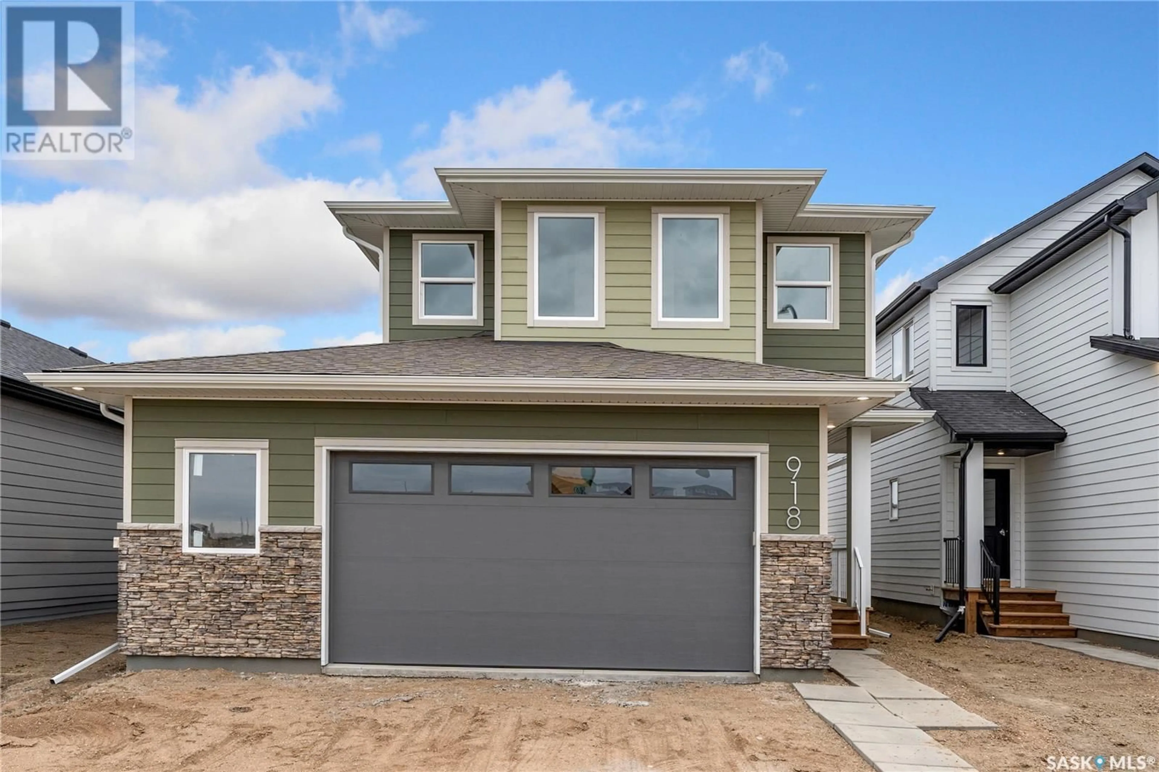 Home with vinyl exterior material, street for 918 BRIGHTON GATE, Saskatoon Saskatchewan S7V1S6