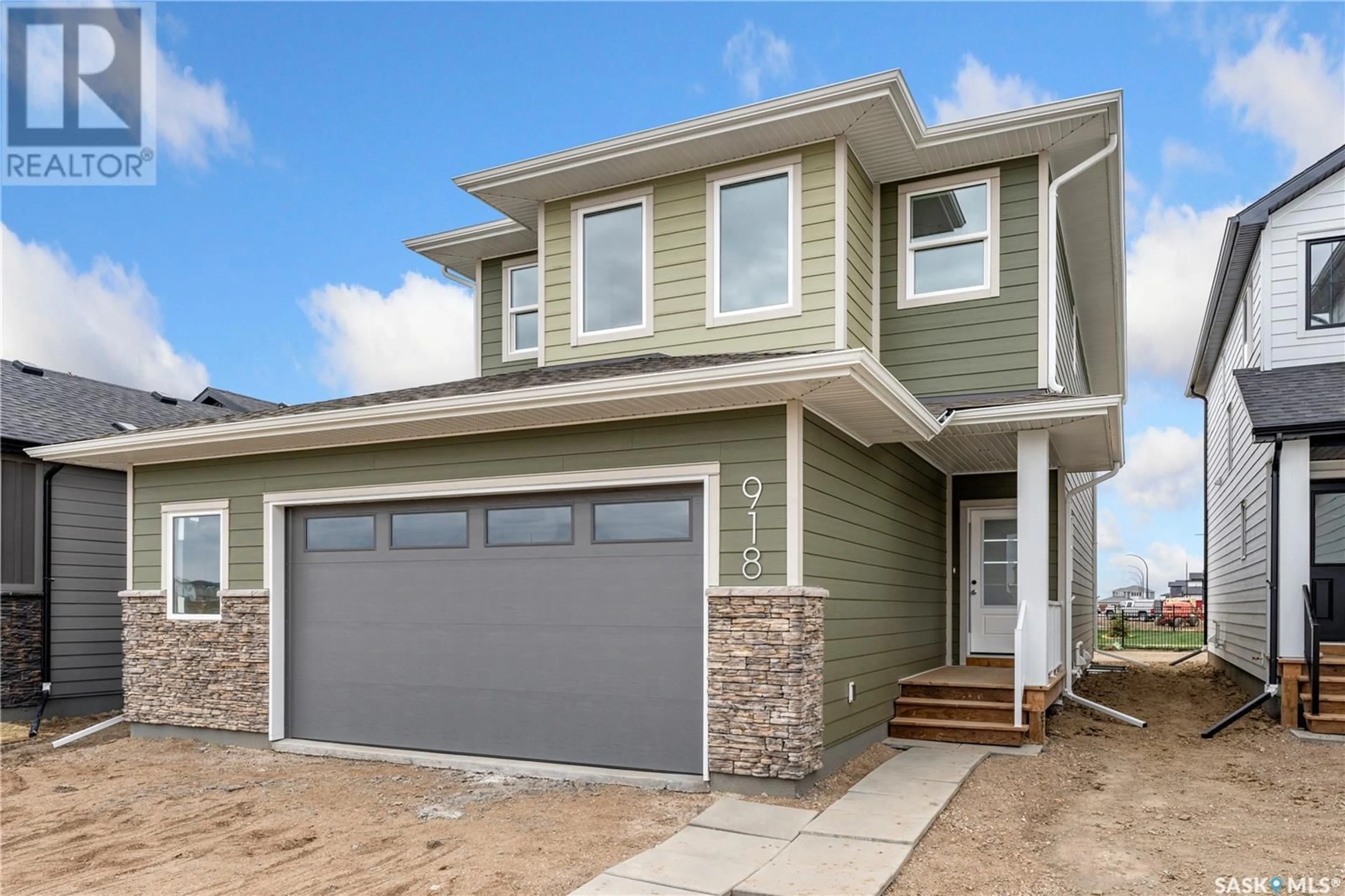 Home with vinyl exterior material, street for 918 BRIGHTON GATE, Saskatoon Saskatchewan S7V1S6