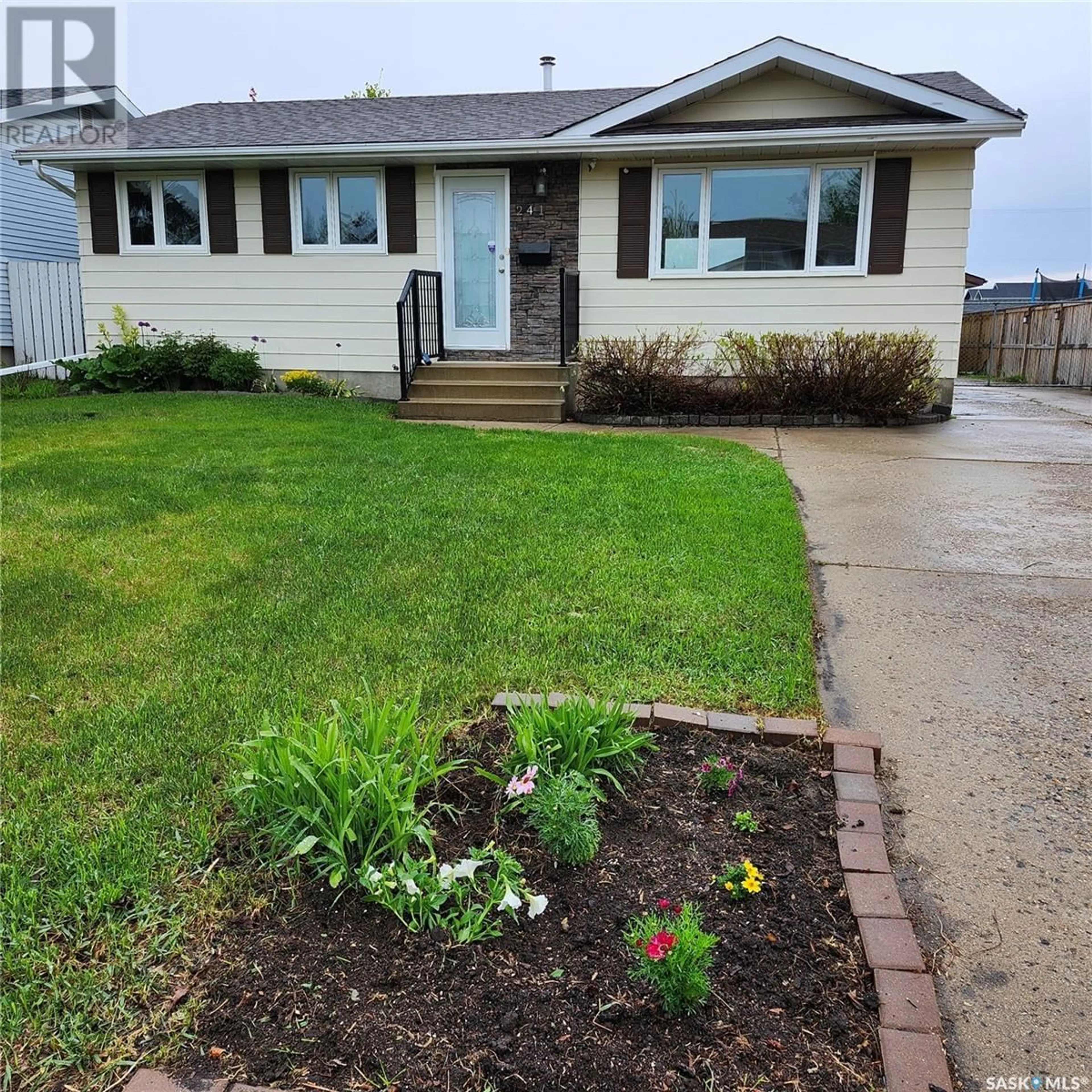 Home with vinyl exterior material, street for 241 GUELPH CRESCENT, Saskatoon Saskatchewan S7H4P9
