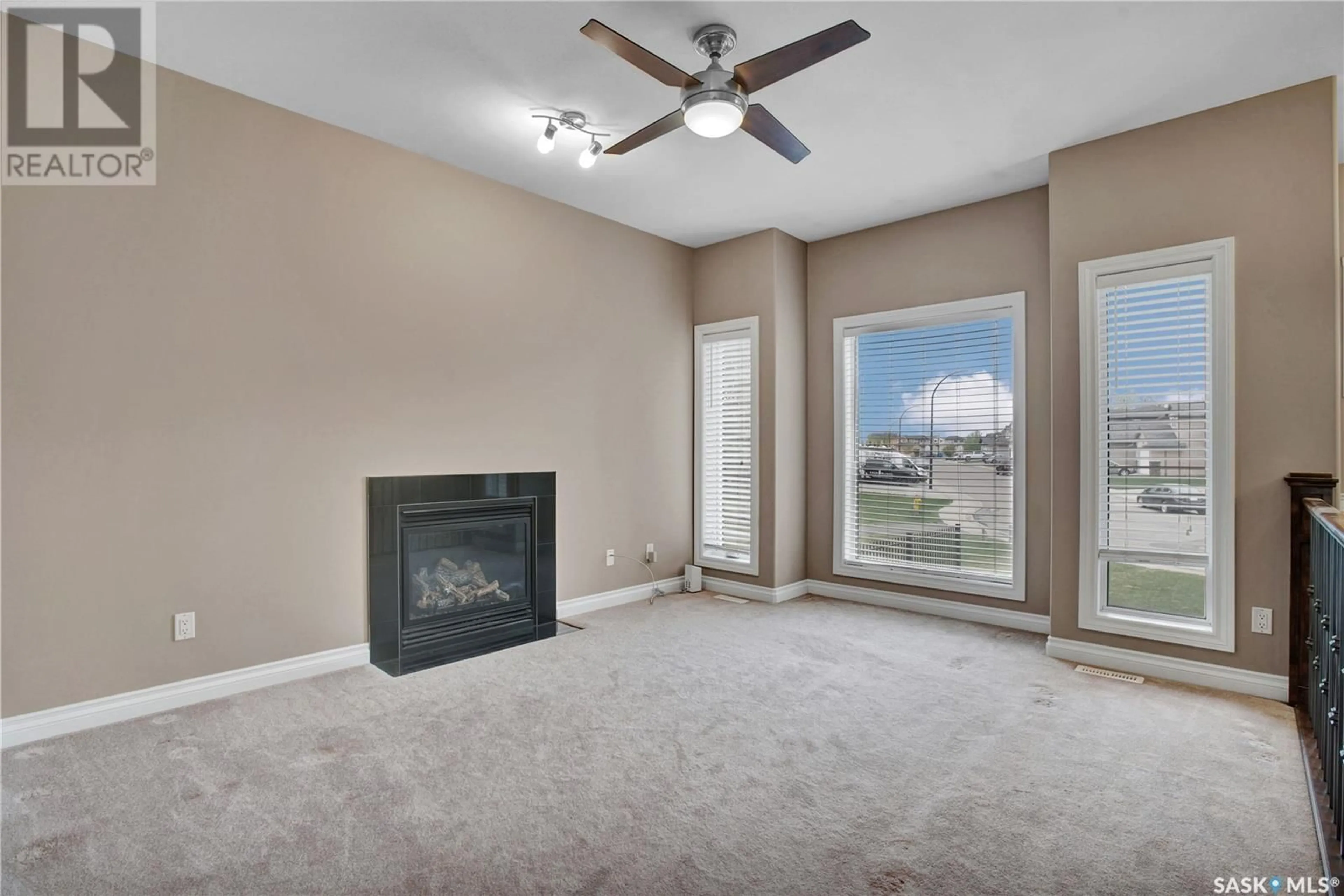 Living room with furniture, carpet floor for 402 MCKAGUE CRESCENT, Saskatoon Saskatchewan S7R0A6