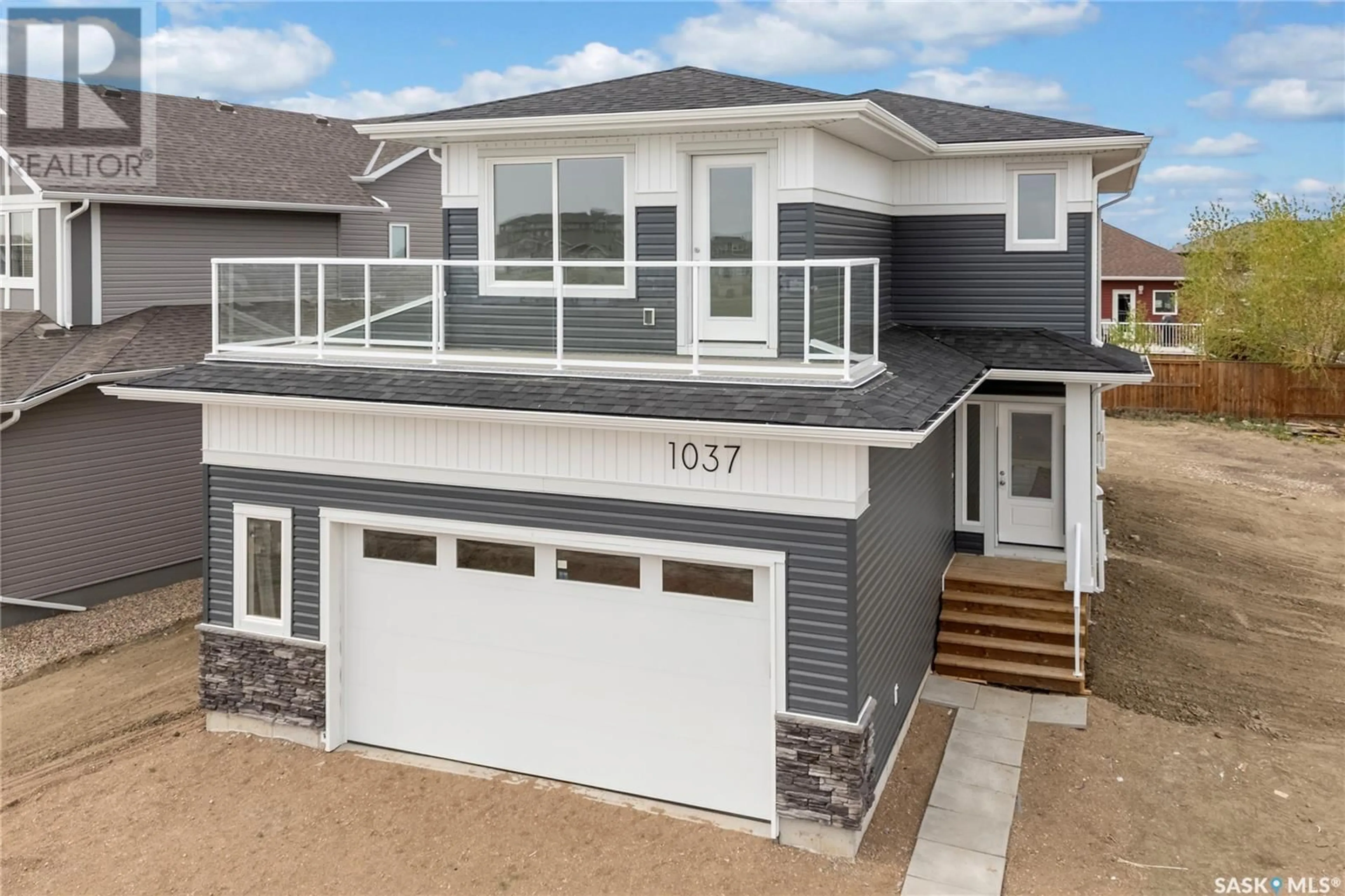Home with vinyl exterior material, street for 1037 3RD STREET, Martensville Saskatchewan S0K2T1