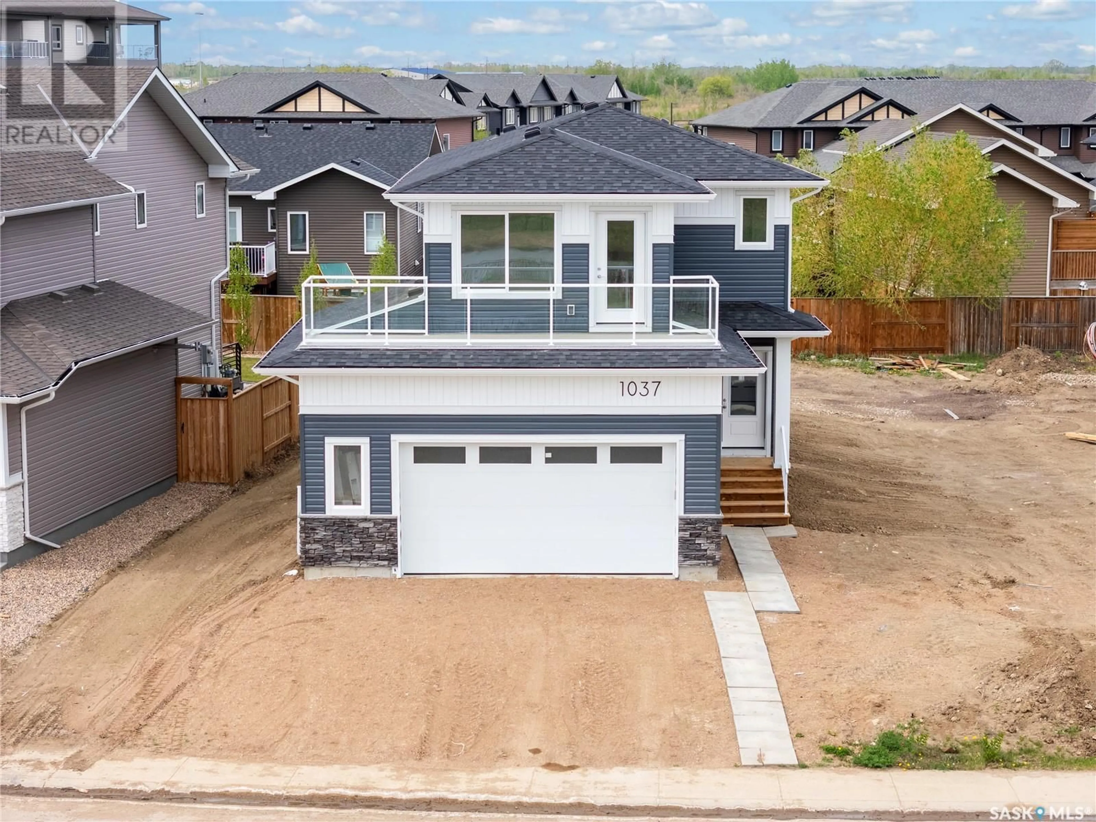 A pic from outside/outdoor area/front of a property/back of a property/a pic from drone, street for 1037 3RD STREET, Martensville Saskatchewan S0K2T1