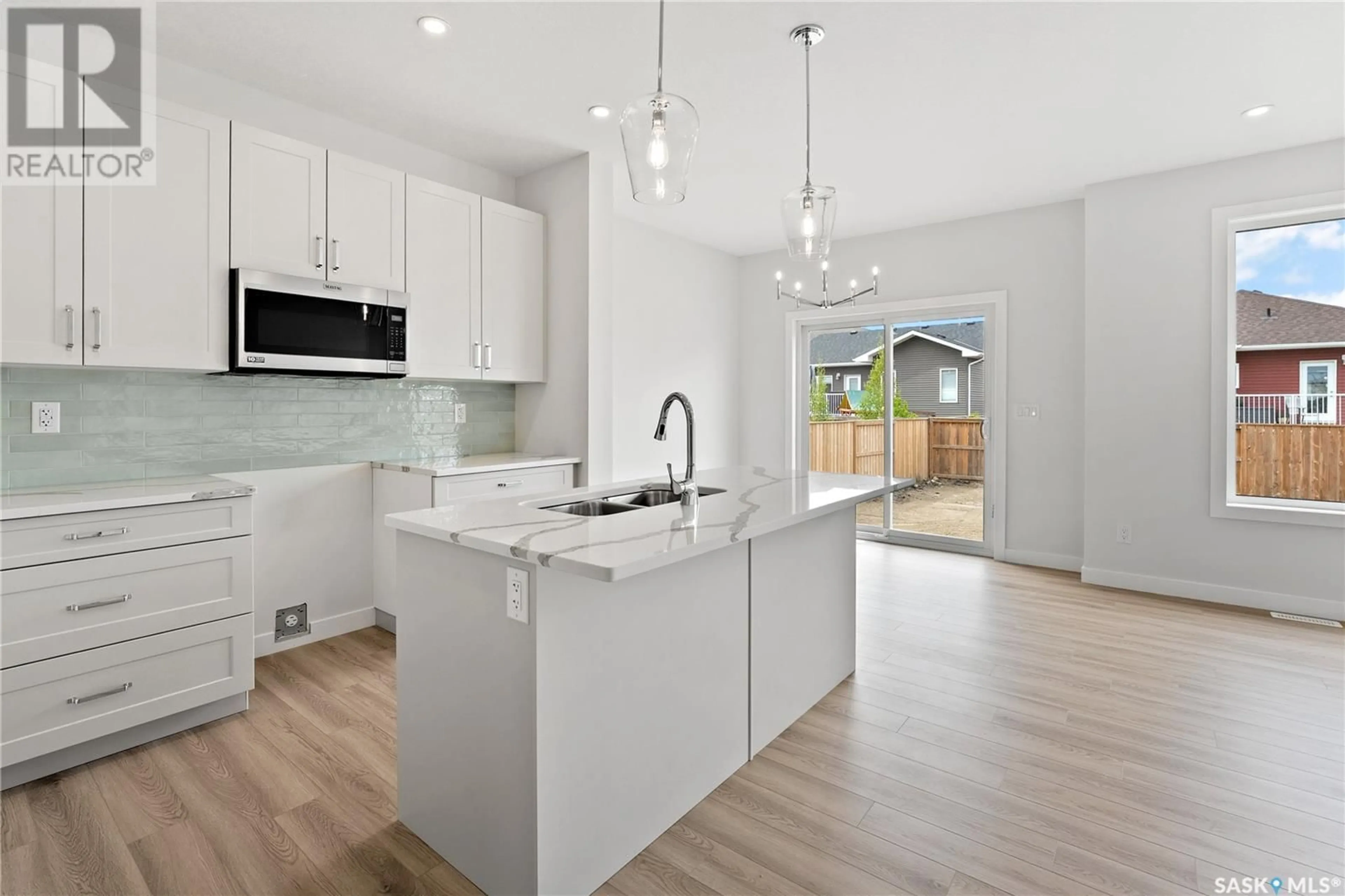 Open concept kitchen, ceramic/tile floor for 1037 3RD STREET, Martensville Saskatchewan S0K2T1