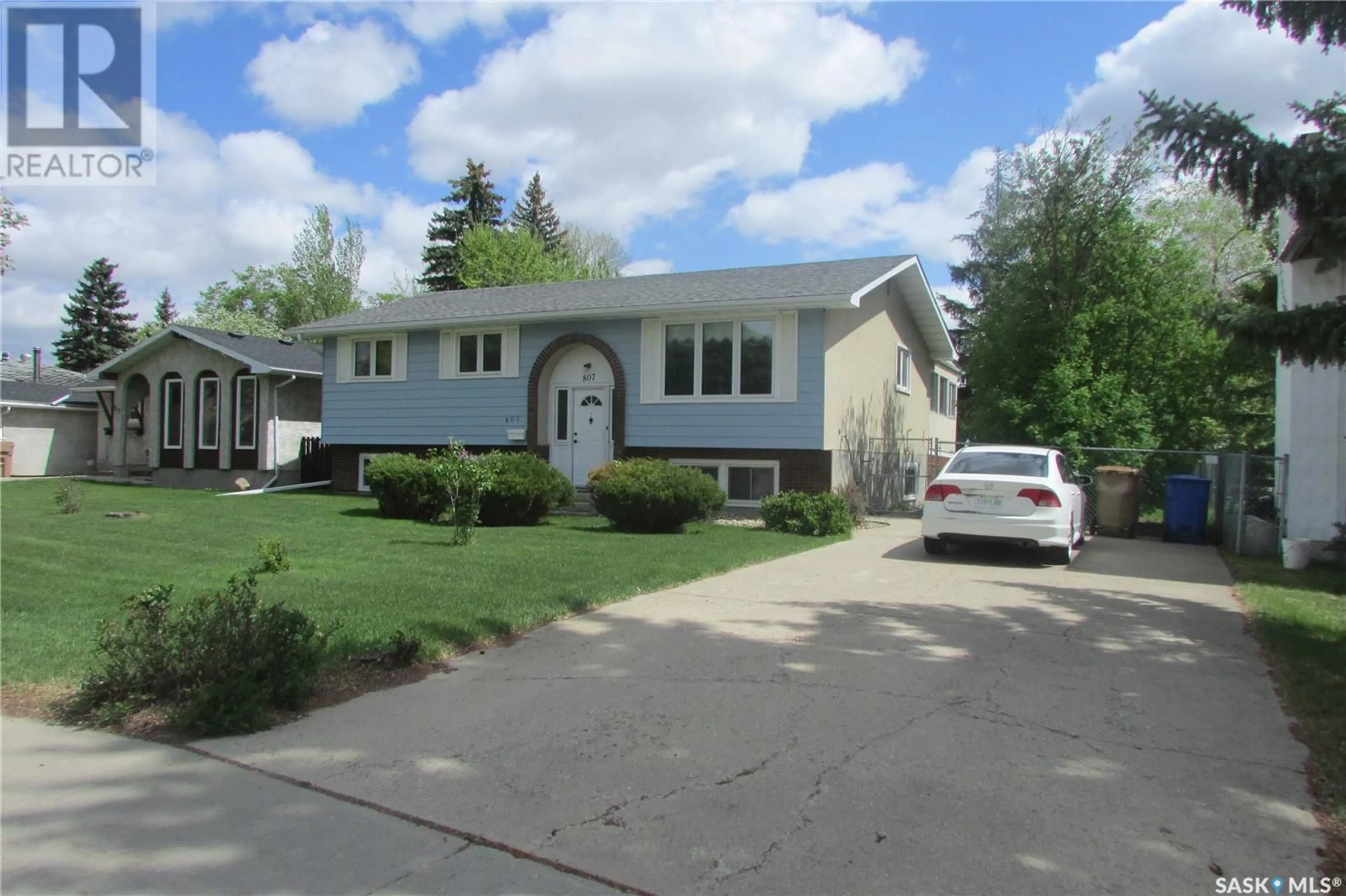 Home with vinyl exterior material, street for 807 MCINTOSH STREET, Regina Saskatchewan S4R6E4