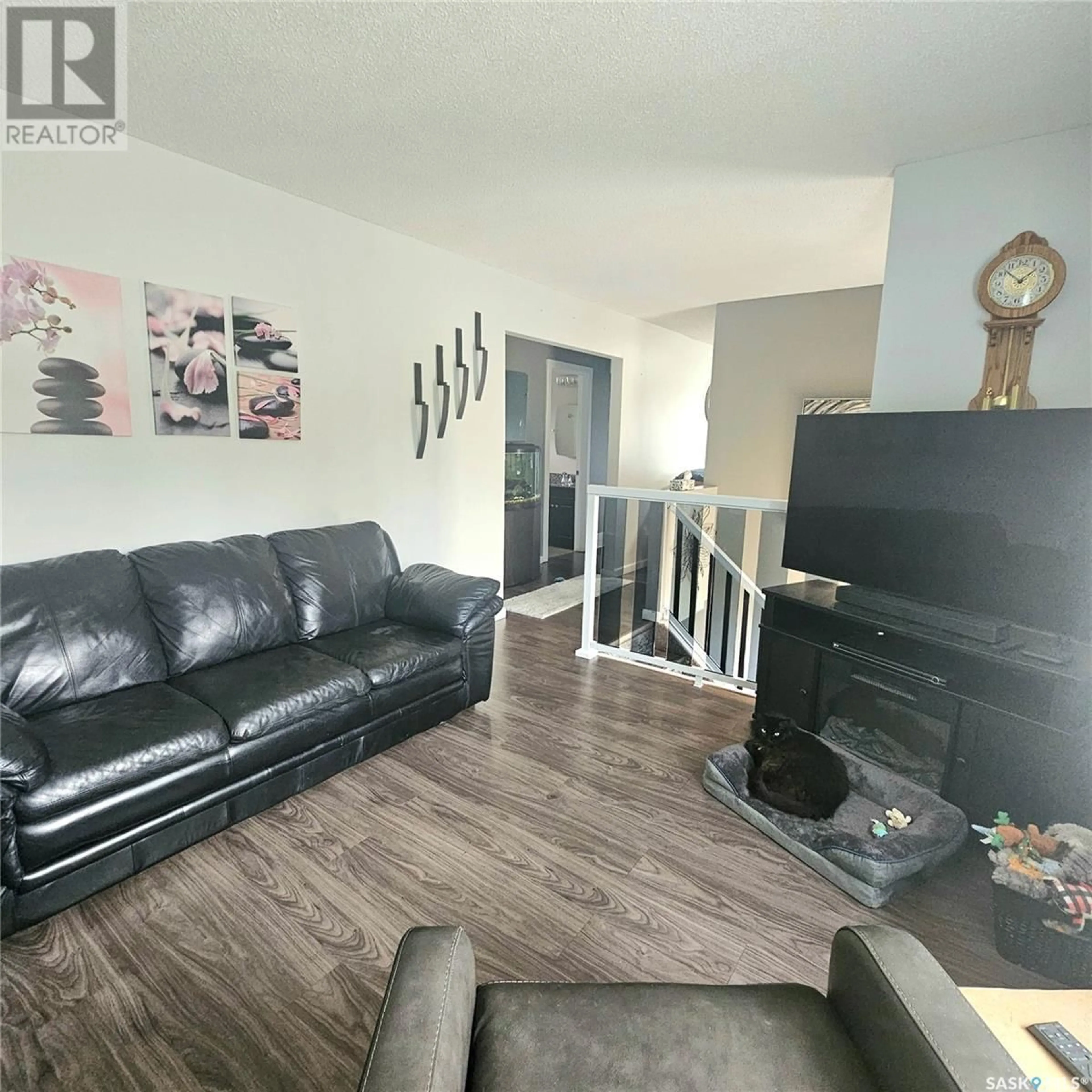 Living room with furniture, wood/laminate floor for 474 MACARTHUR DRIVE, Prince Albert Saskatchewan S6V5X4