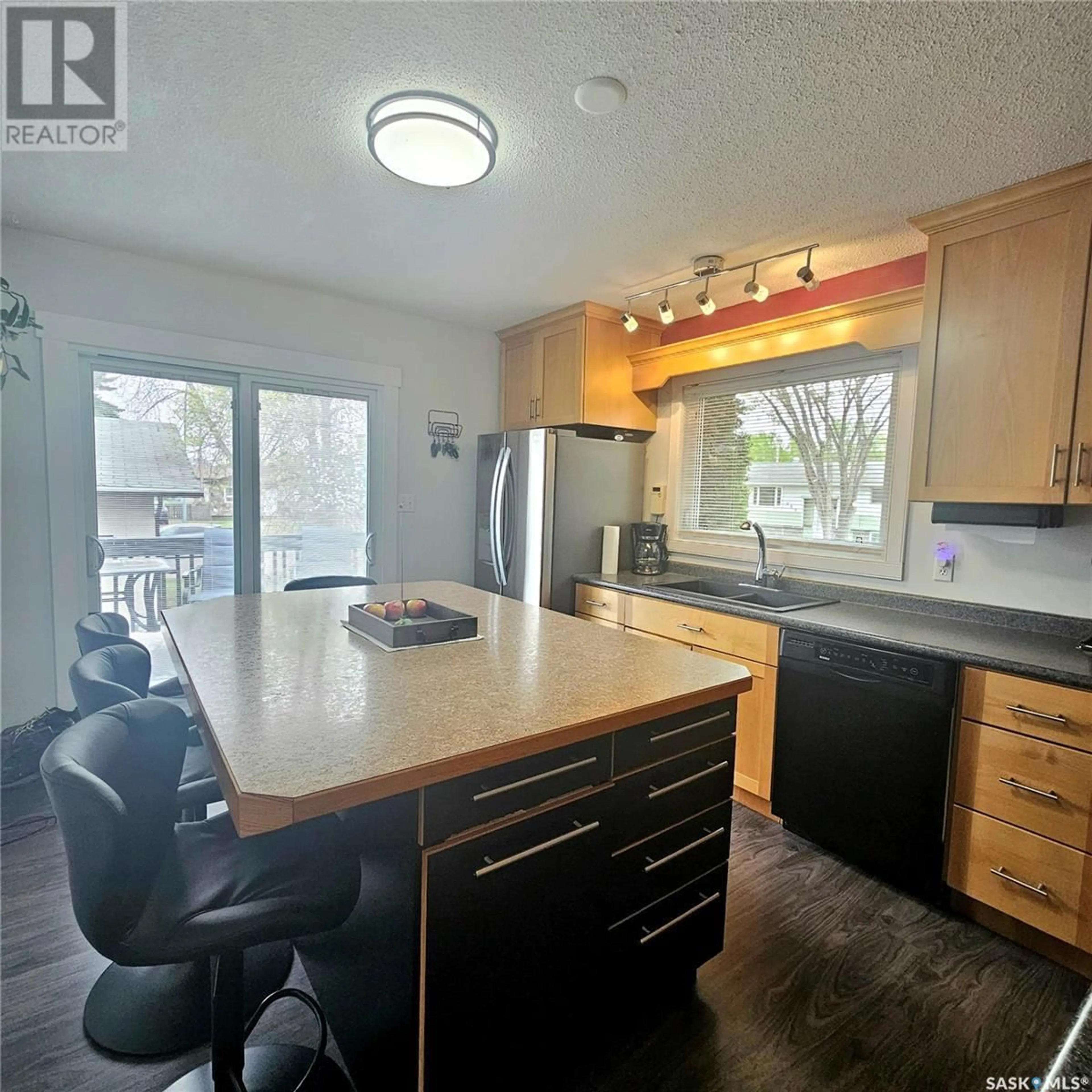 Open concept kitchen, wood/laminate floor for 474 MACARTHUR DRIVE, Prince Albert Saskatchewan S6V5X4