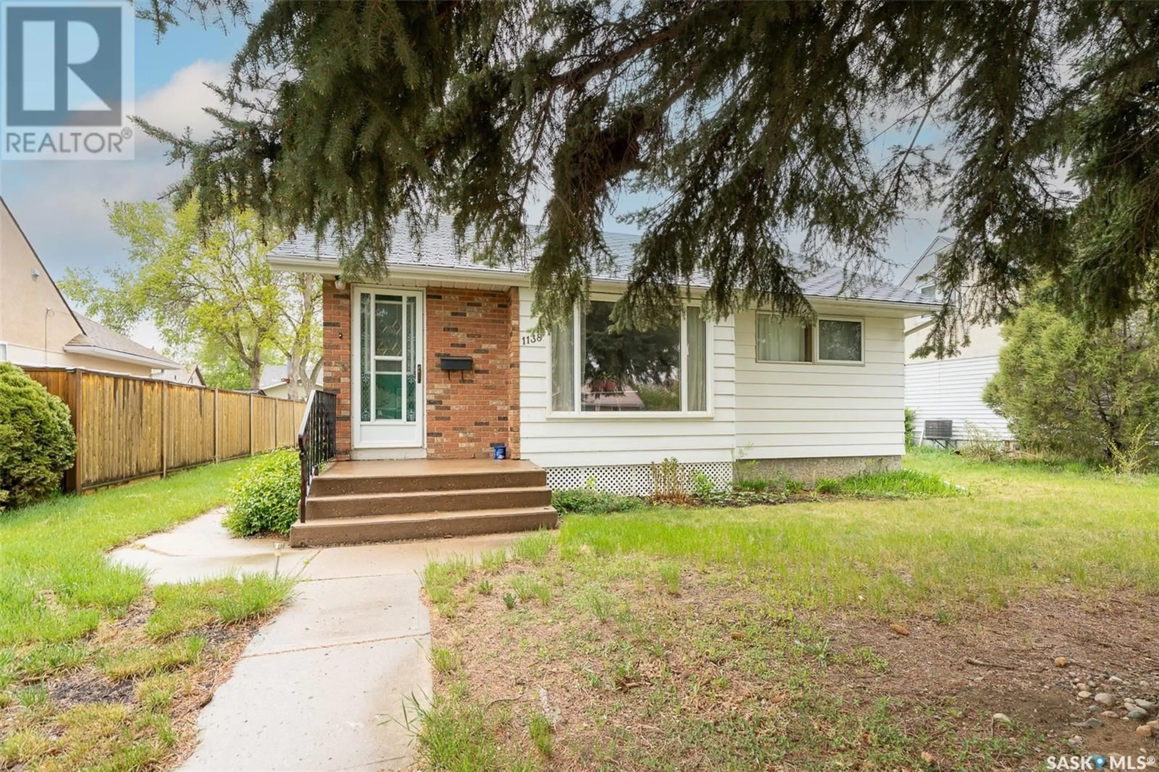 Home with vinyl exterior material, street for 1138 7TH AVENUE, Moose Jaw Saskatchewan S6H4C5