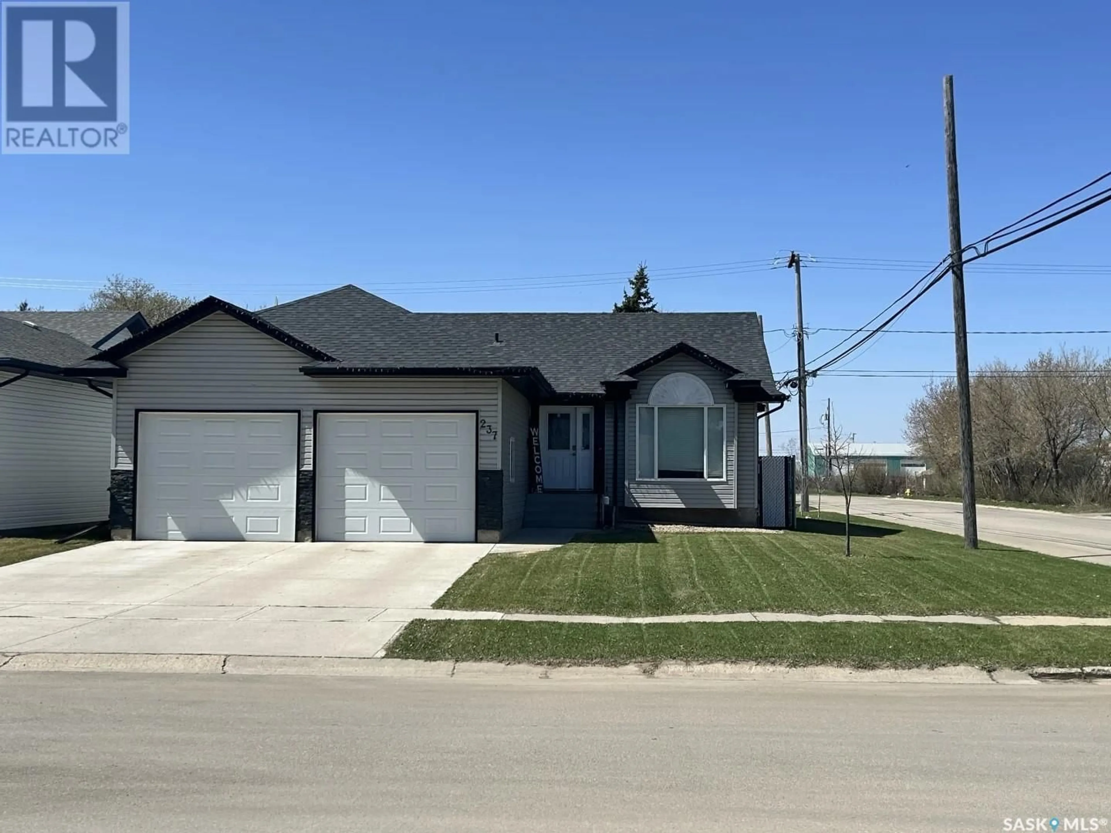 Home with vinyl exterior material, street for 237 10TH STREET, Humboldt Saskatchewan S0K2A0
