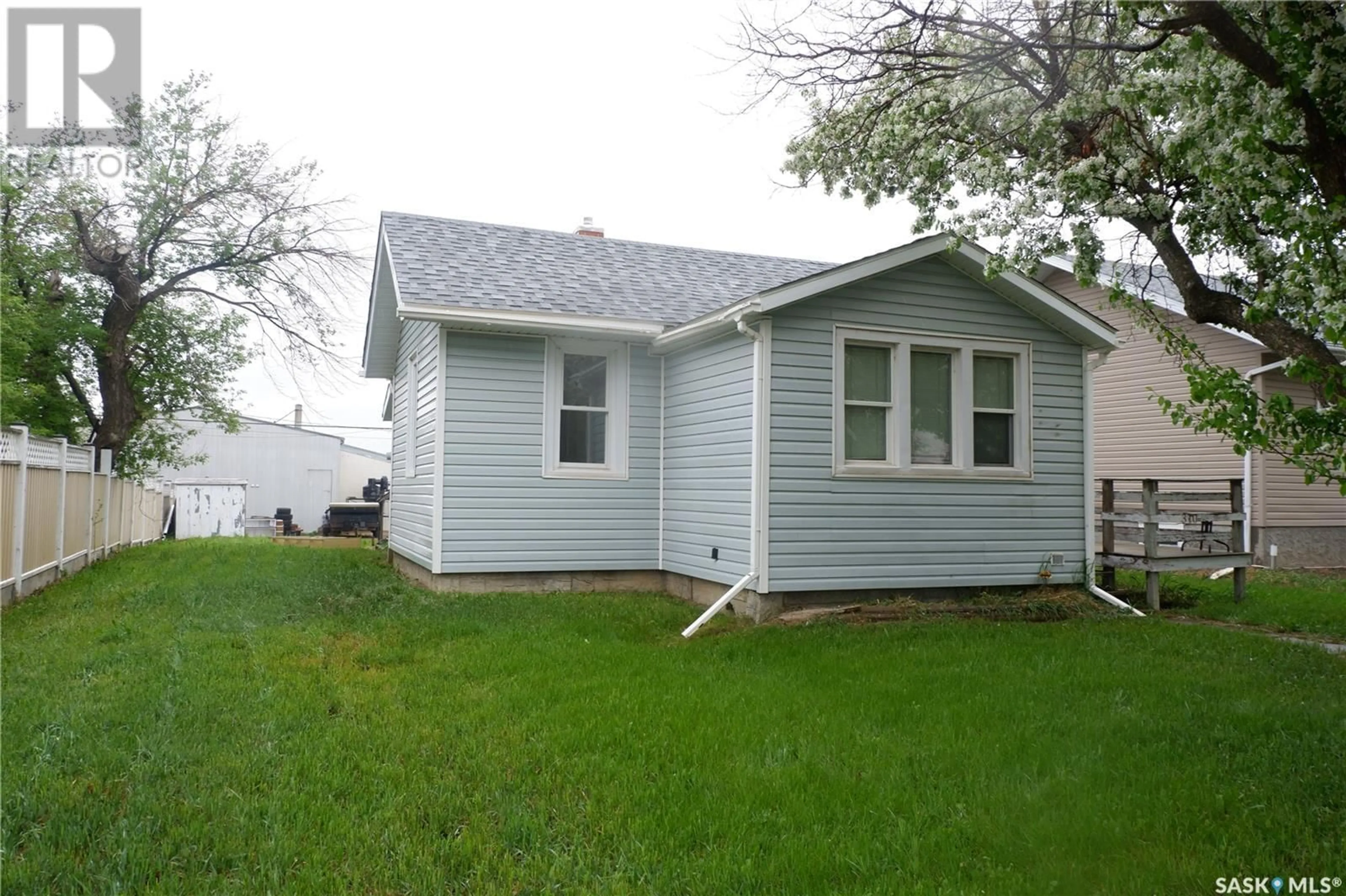 Home with vinyl exterior material, street for 310 2ND AVENUE, Assiniboia Saskatchewan S0H0B0