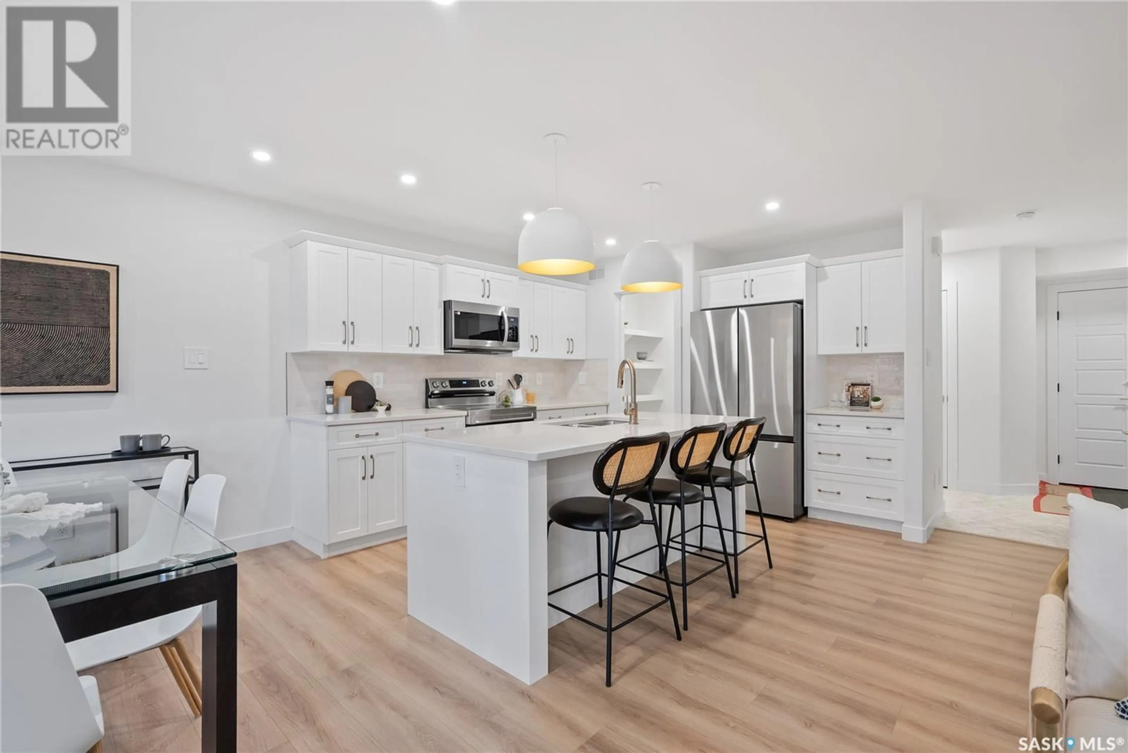 Open concept kitchen, wood/laminate floor for 170 DORAN WAY, Saskatoon Saskatchewan S7V0Z7