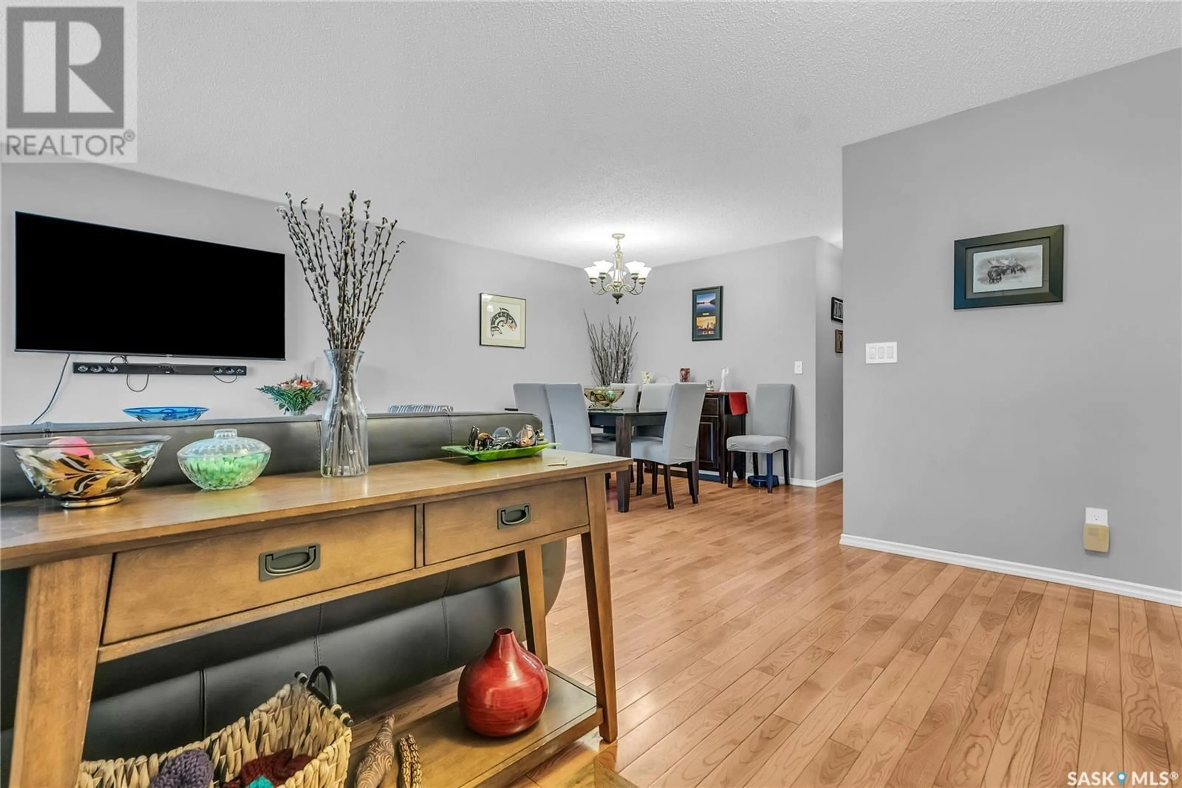 Living room with furniture, wood/laminate floor for 607 WEBSTER STREET, Saskatoon Saskatchewan S7N3G6