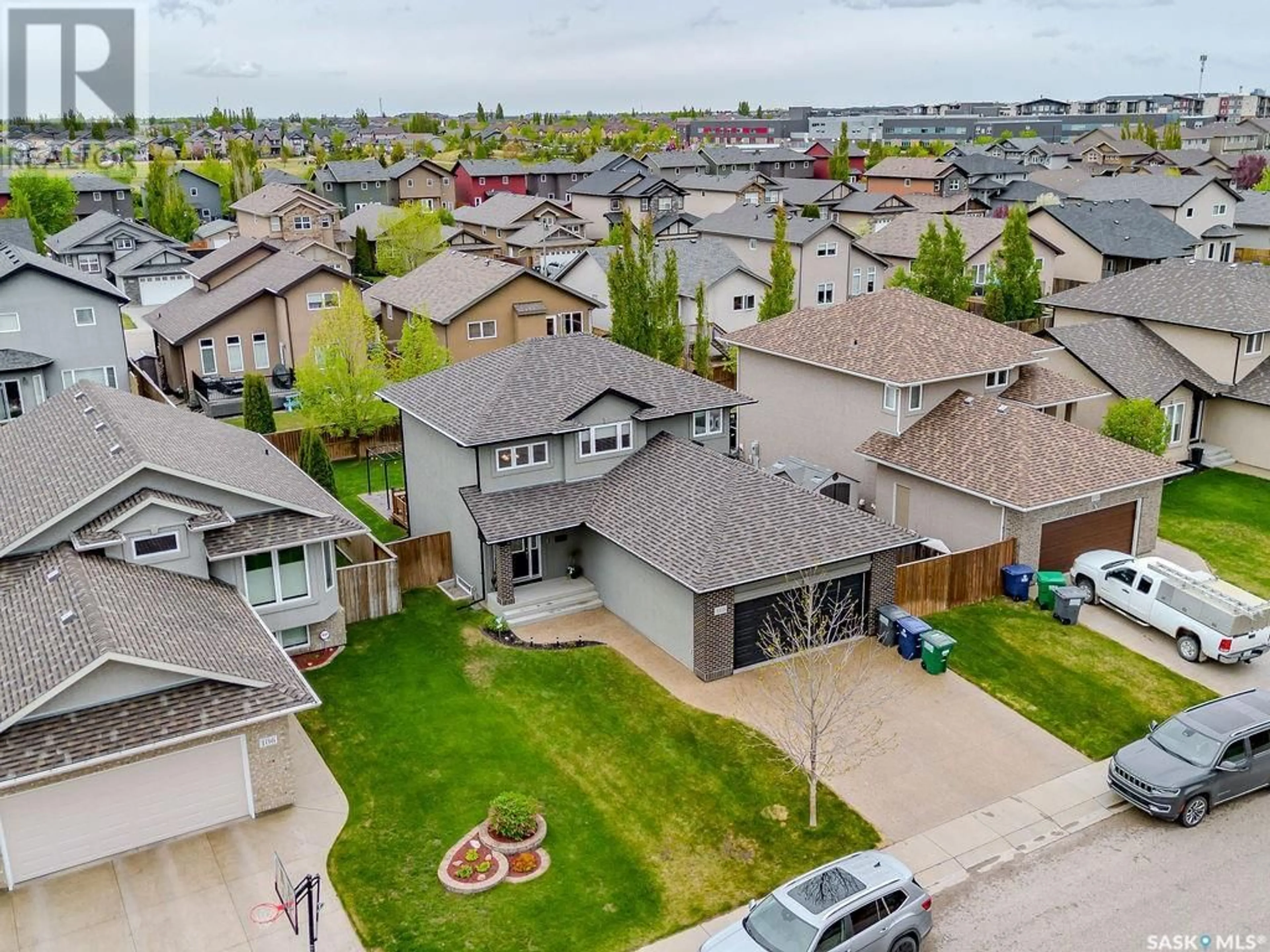 A pic from outside/outdoor area/front of a property/back of a property/a pic from drone, street for 110 ALM CRESCENT, Saskatoon Saskatchewan S7T0E1