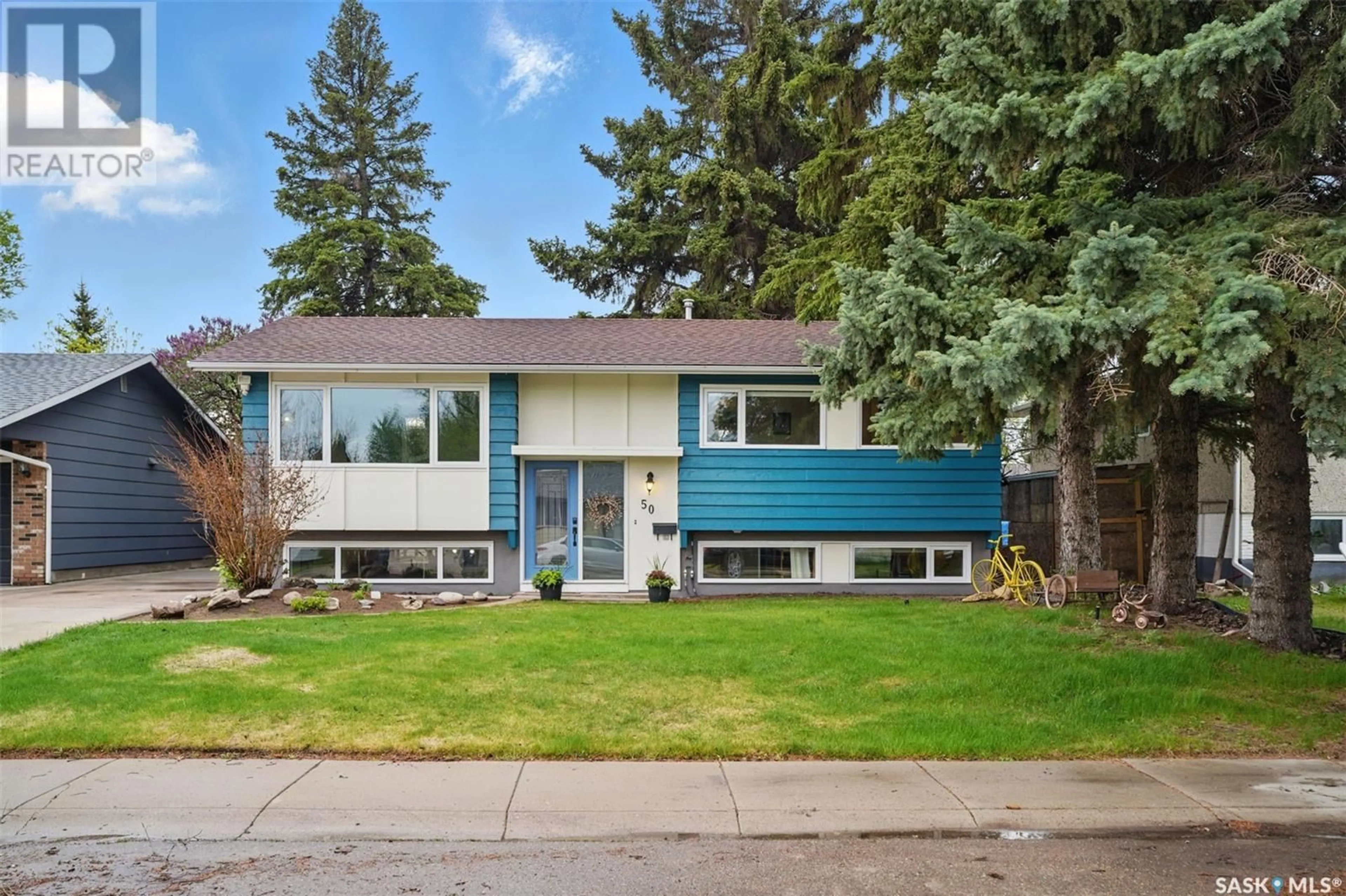 Home with vinyl exterior material, street for 50 LEDDY CRESCENT, Saskatoon Saskatchewan S7H3Y6