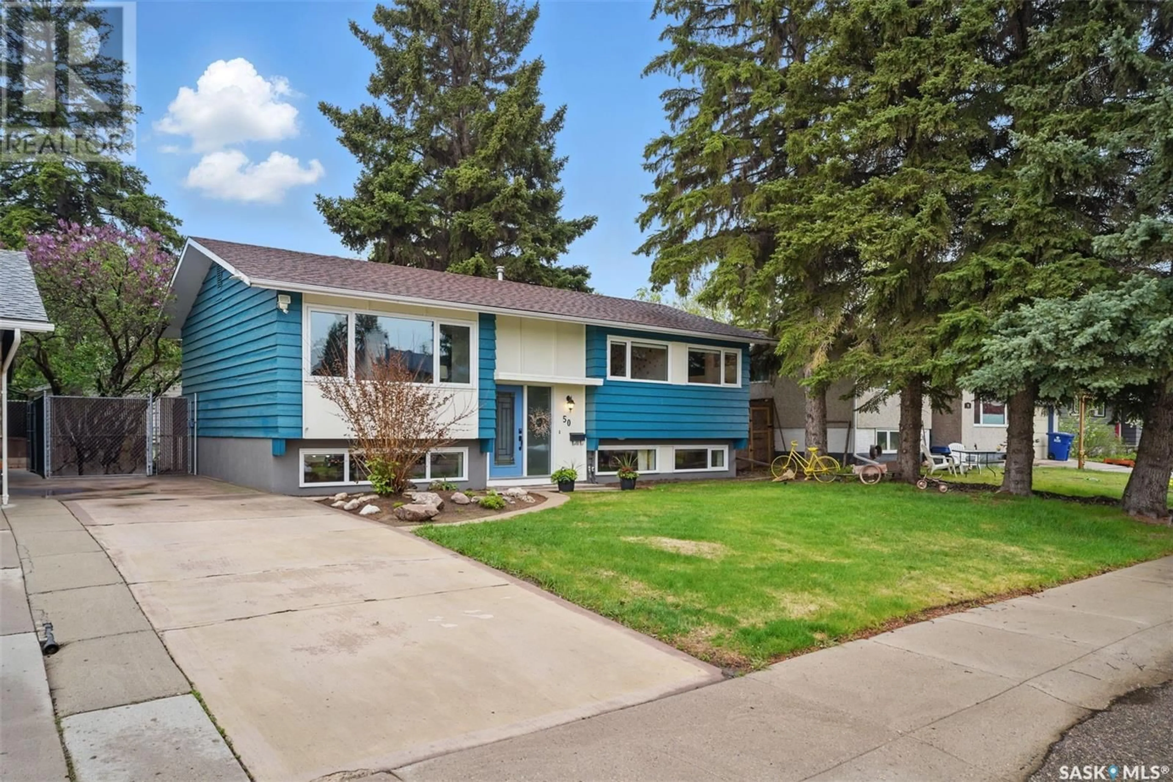 Home with vinyl exterior material, street for 50 LEDDY CRESCENT, Saskatoon Saskatchewan S7H3Y6