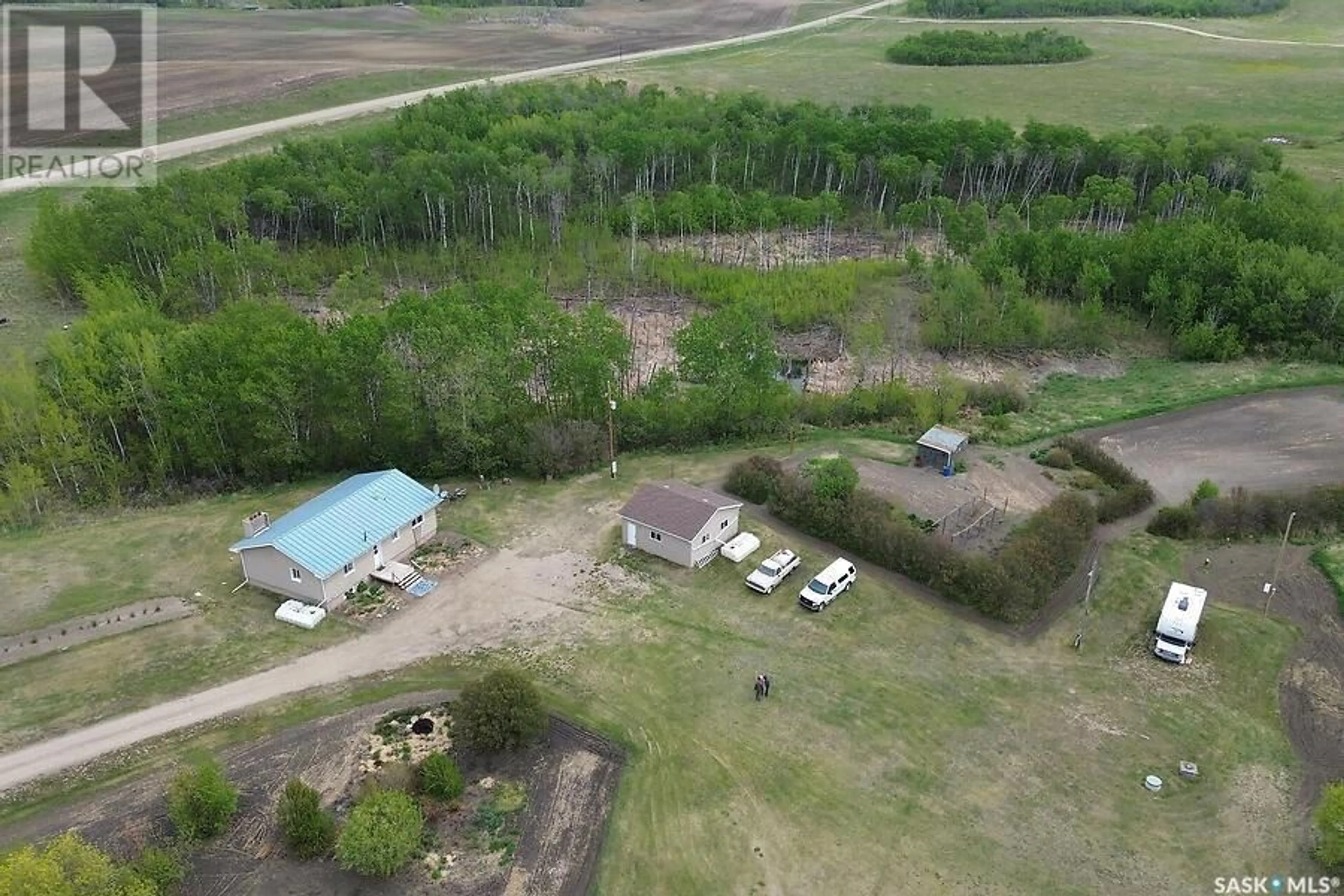 A pic from outside/outdoor area/front of a property/back of a property/a pic from drone, building for HALTER ACREAGE, Fish Creek Rm No. 402 Saskatchewan S0K0E0