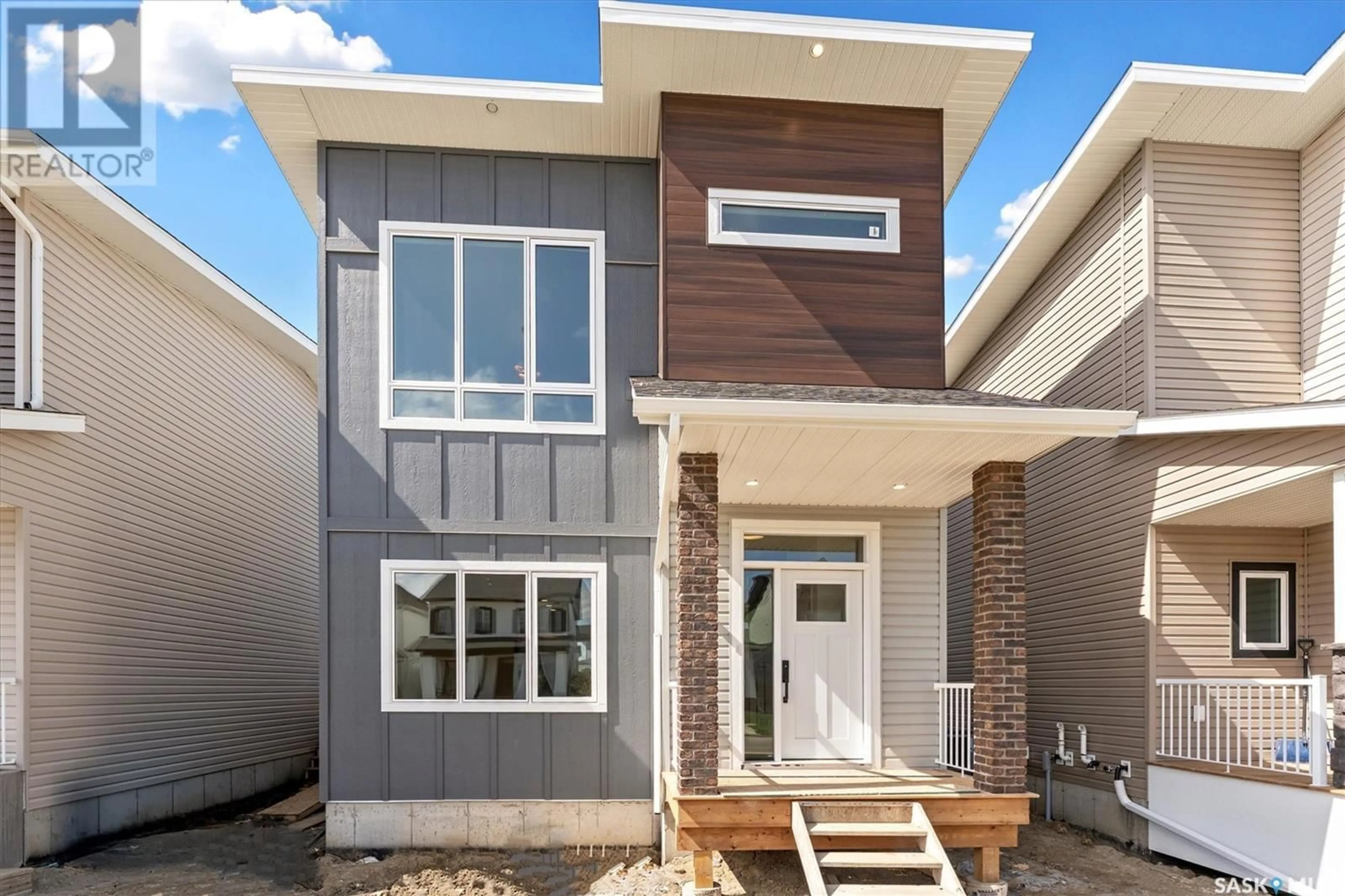 Home with brick exterior material, street for 166 TAUBE AVENUE, Saskatoon Saskatchewan S7V1L6