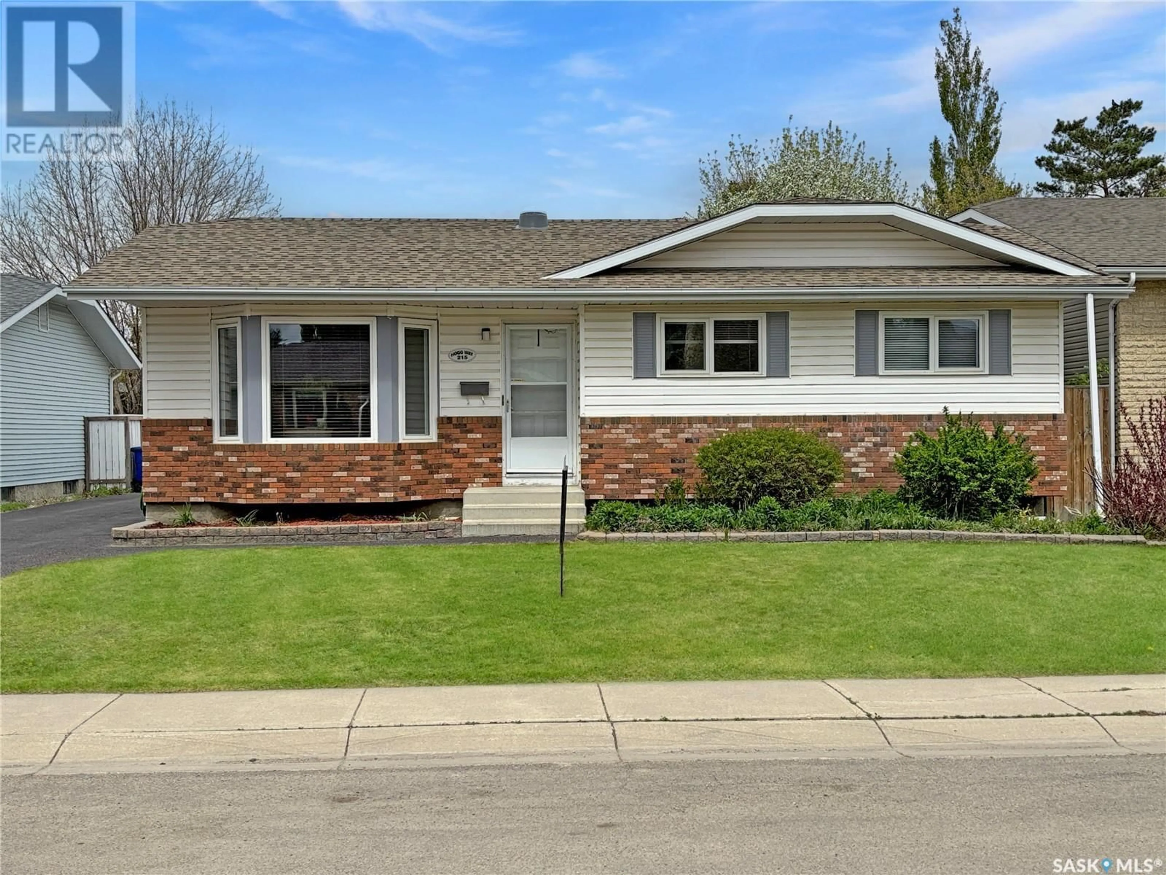 Home with vinyl exterior material, street for 215 HOGG WAY, Saskatoon Saskatchewan S7N3W4
