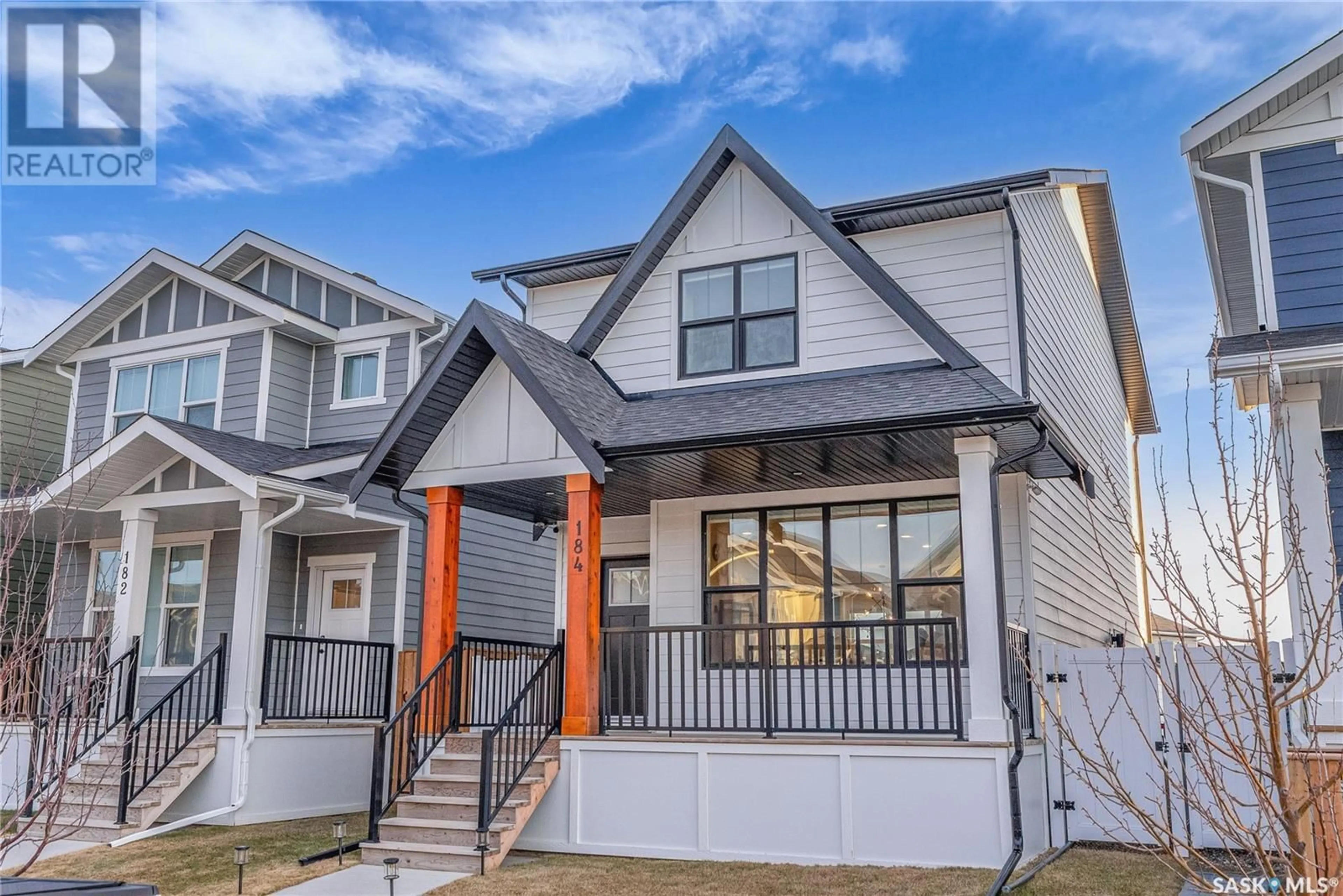 Home with vinyl exterior material, street for 184 ROSEWOOD BOULEVARD, Saskatoon Saskatchewan S7V0Y9