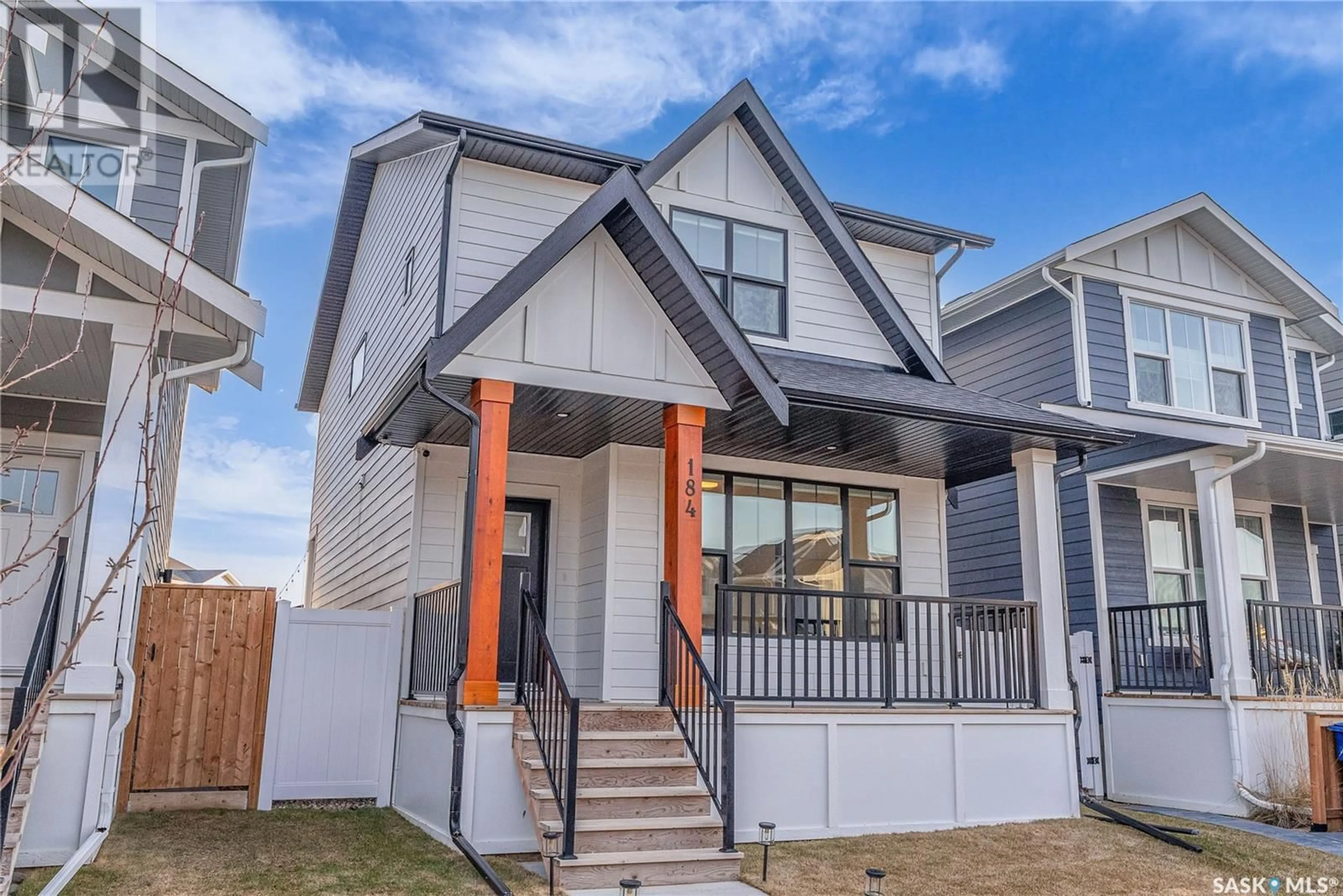 Home with vinyl exterior material, street for 184 ROSEWOOD BOULEVARD, Saskatoon Saskatchewan S7V0Y9