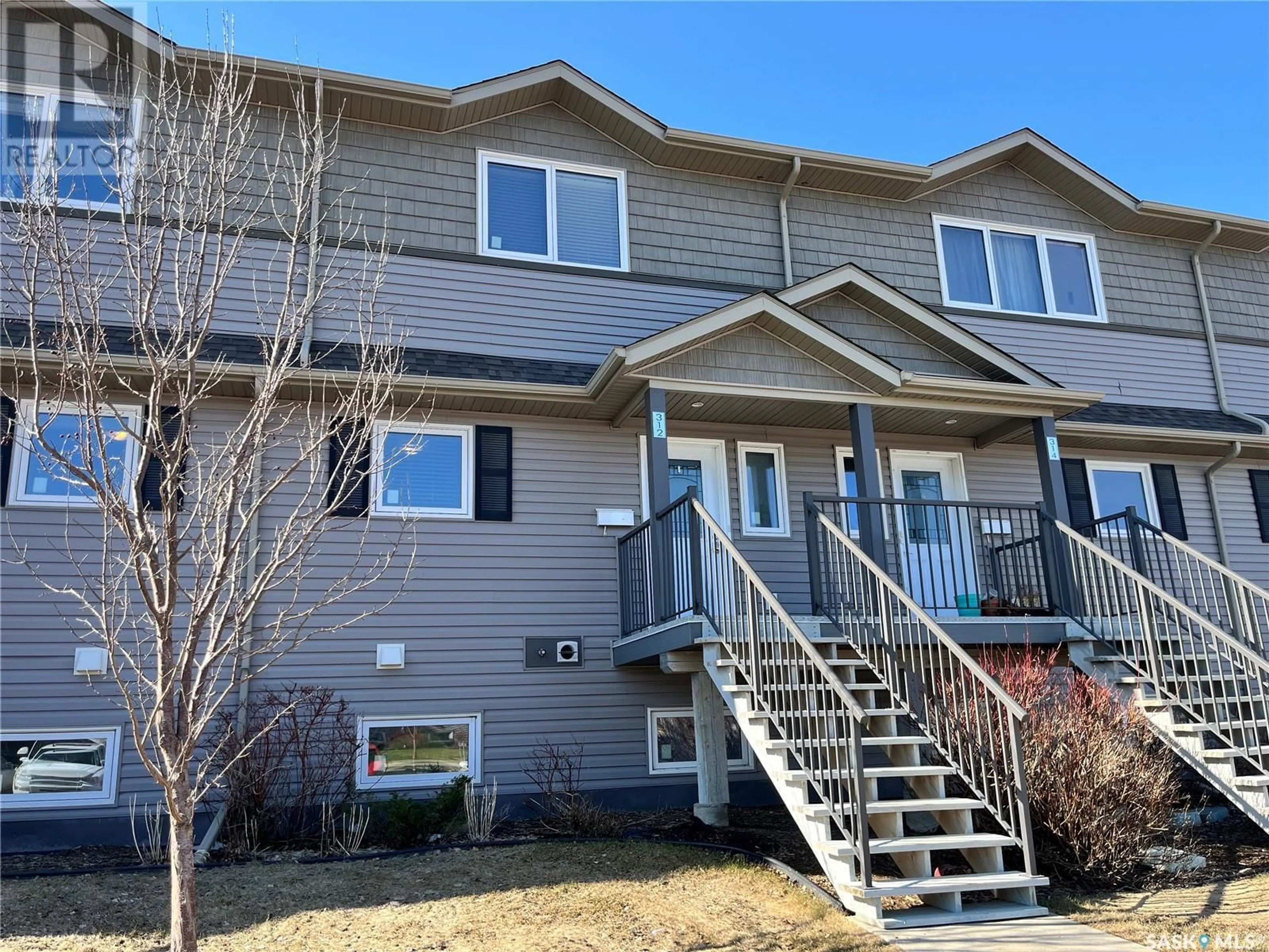 Home with vinyl exterior material, street for 115 - 312 DALGLEISH LINK, Saskatoon Saskatchewan S7W0N5