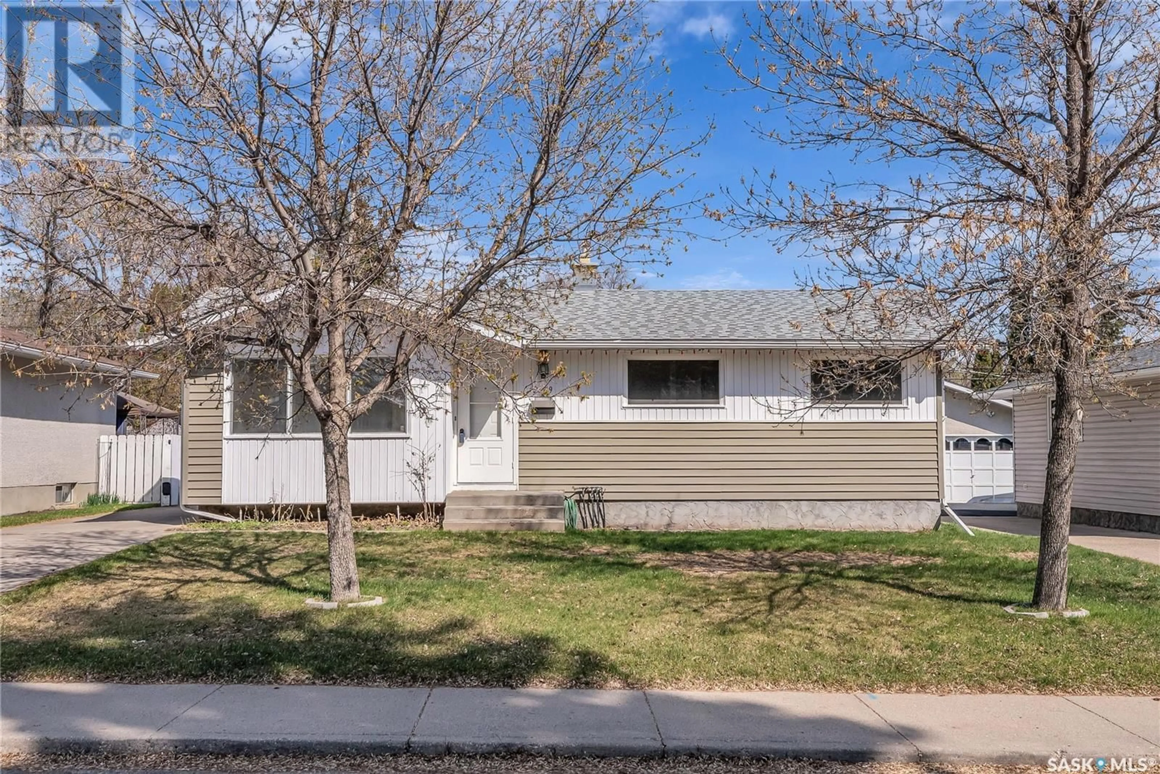 Home with vinyl exterior material, street for 2509 IRVINE AVENUE, Saskatoon Saskatchewan S7J2A9