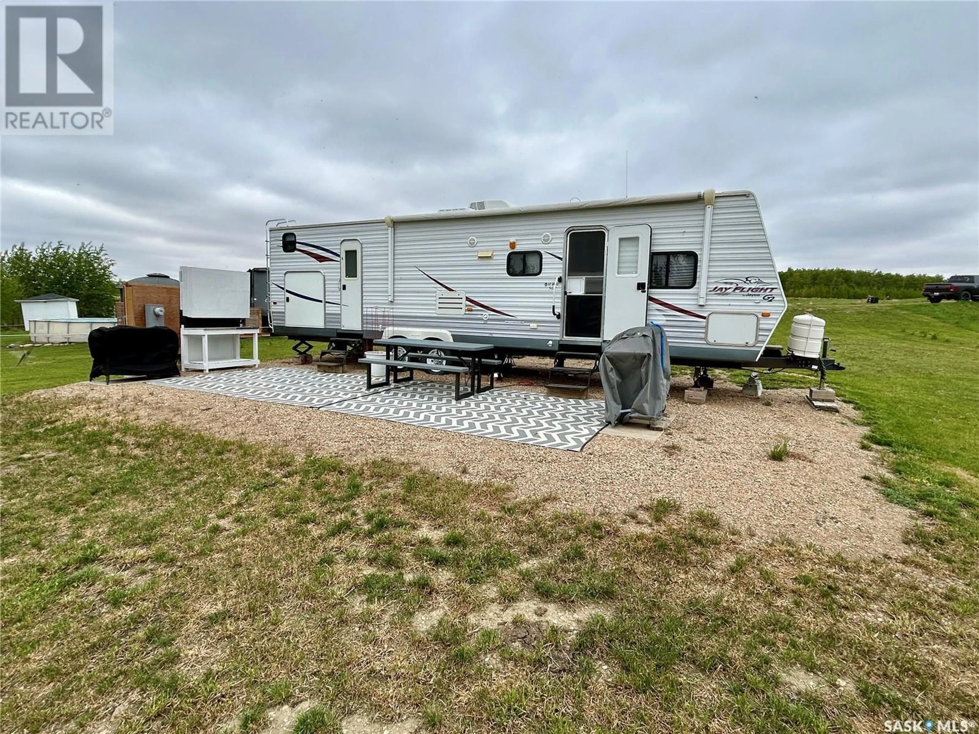 A pic from outside/outdoor area/front of a property/back of a property/a pic from drone, water/lake/river/ocean view for 228 BOUCHARD LANE, Dixon Lake Saskatchewan S0X1A0