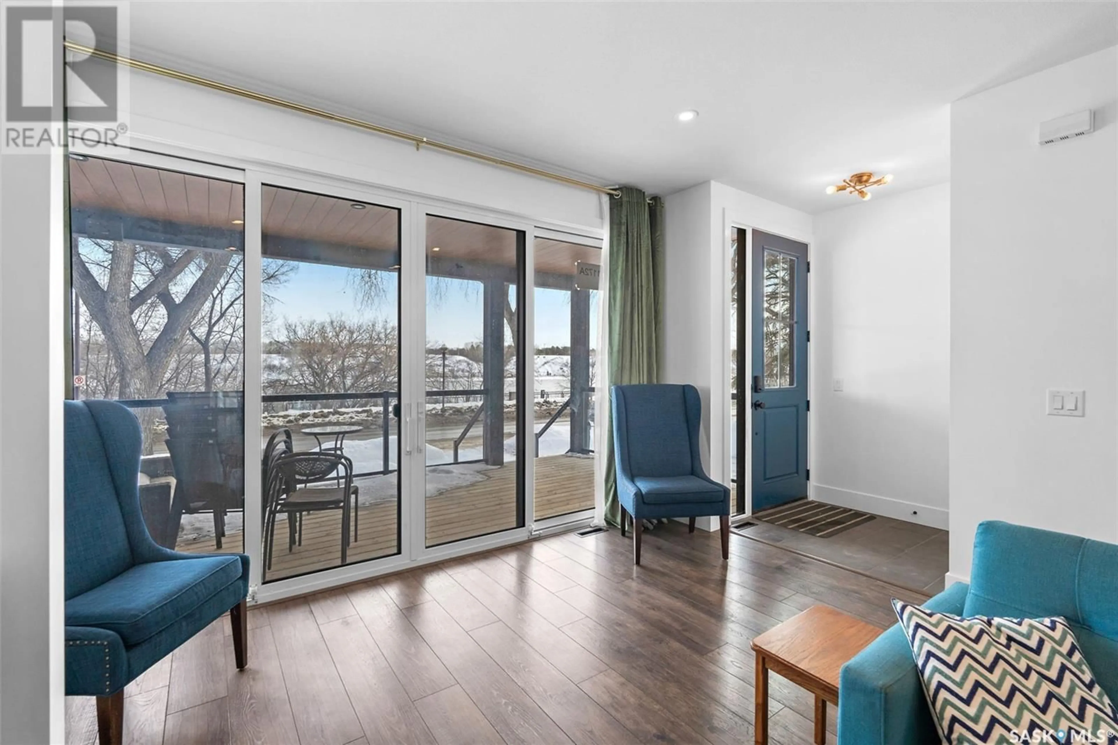 Living room with furniture, wood/laminate floor for 1172A SPADINA CRESCENT, Saskatoon Saskatchewan S7K3H8