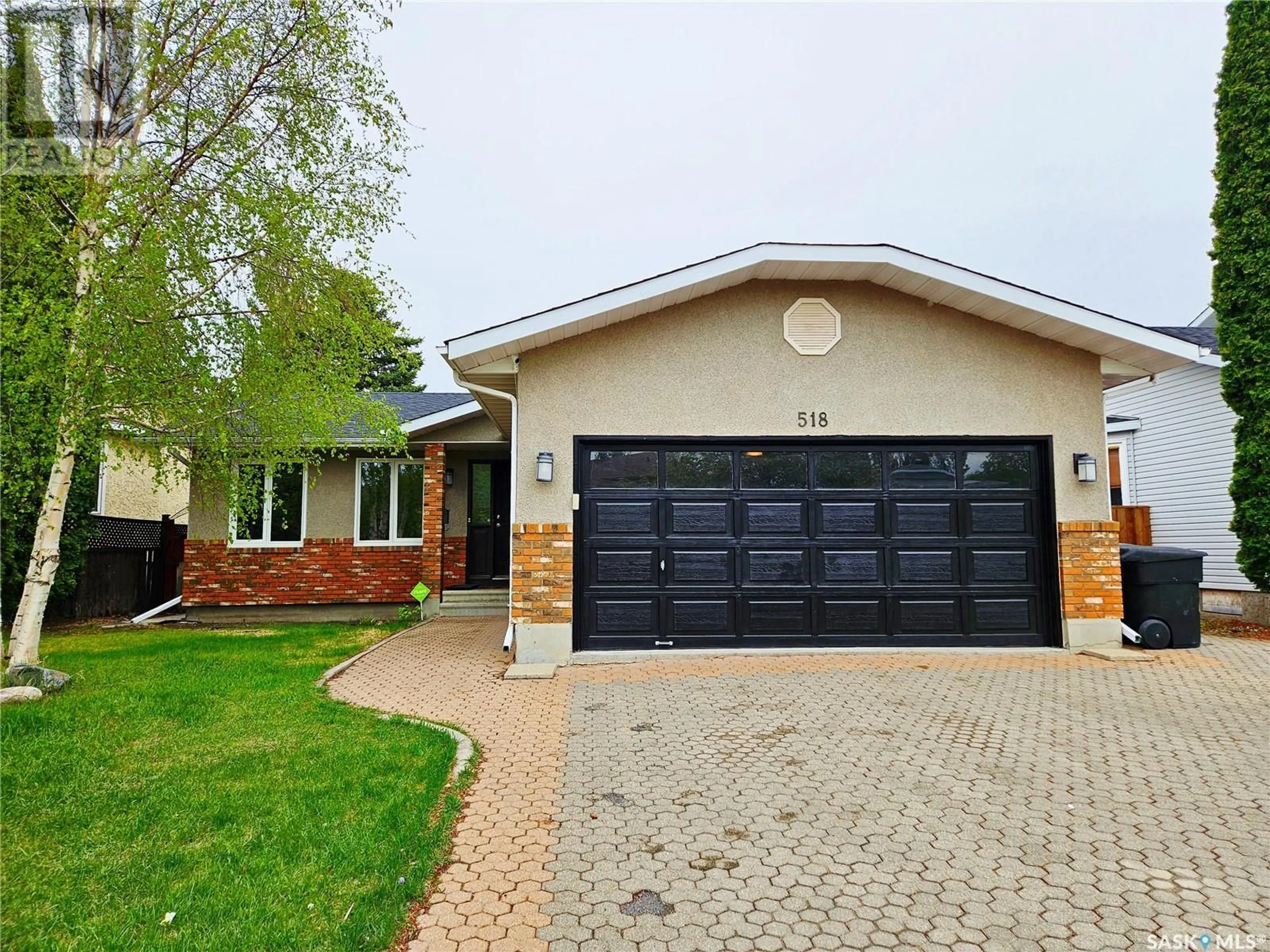 Home with brick exterior material, street for 518 BONLI CRESCENT, Saskatoon Saskatchewan S7N4A3