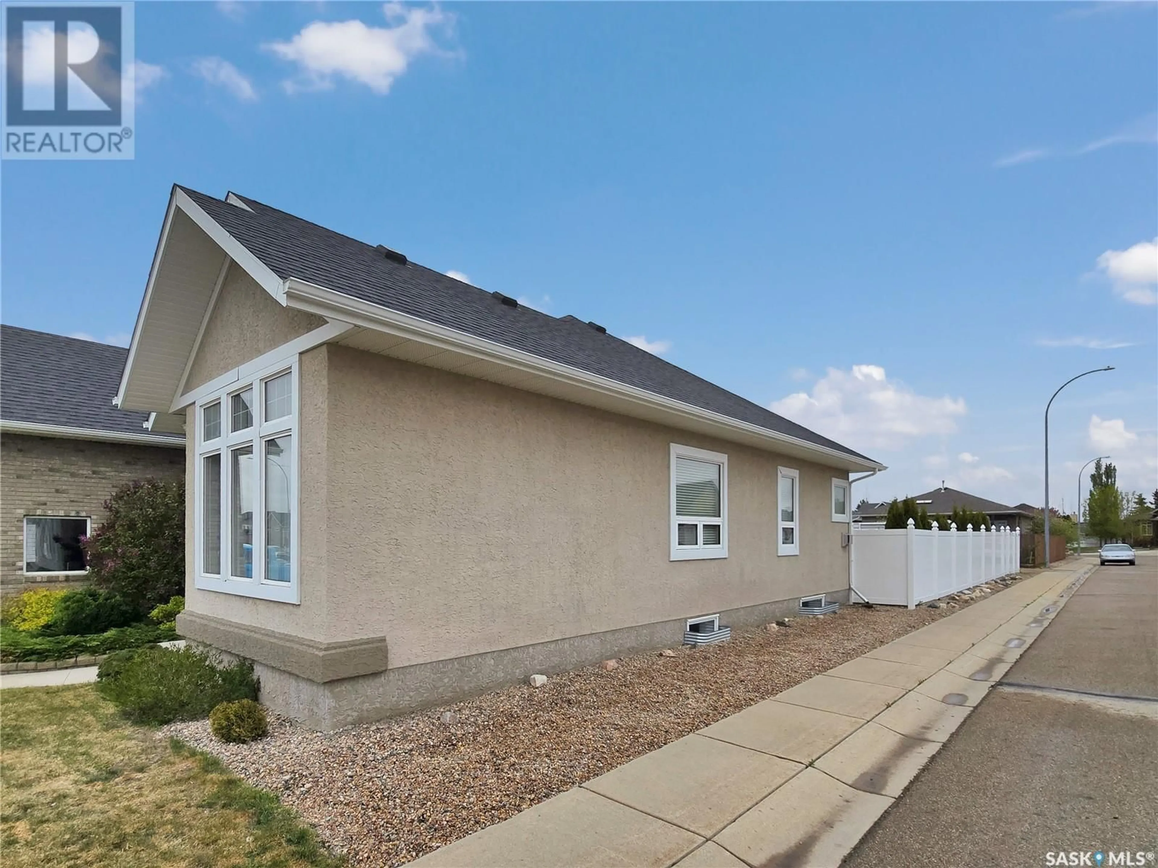 Home with vinyl exterior material, street for 302 LAKERIDGE DRIVE, Warman Saskatchewan S0K4S2