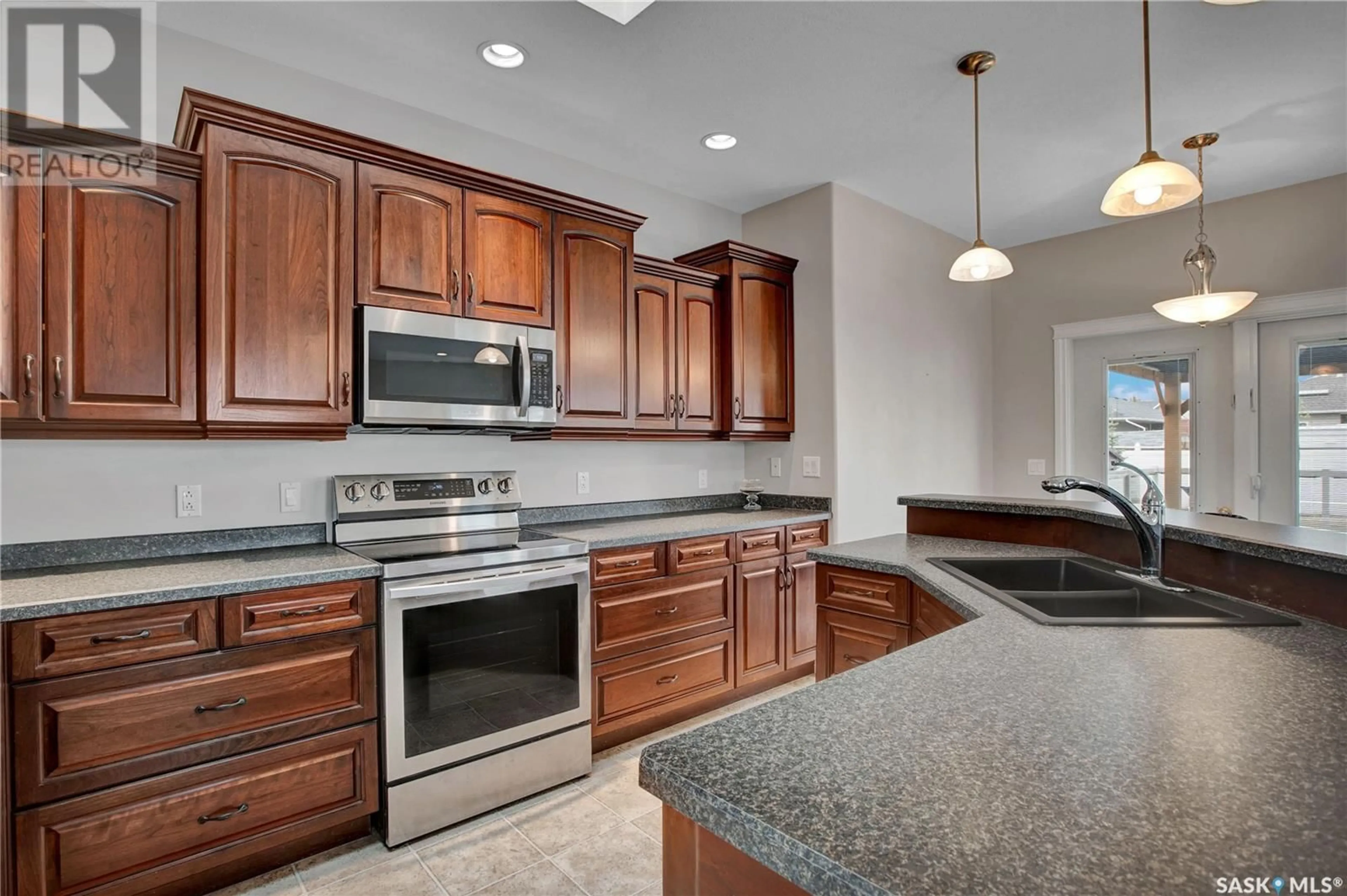 Open concept kitchen, ceramic/tile floor for 302 LAKERIDGE DRIVE, Warman Saskatchewan S0K4S2