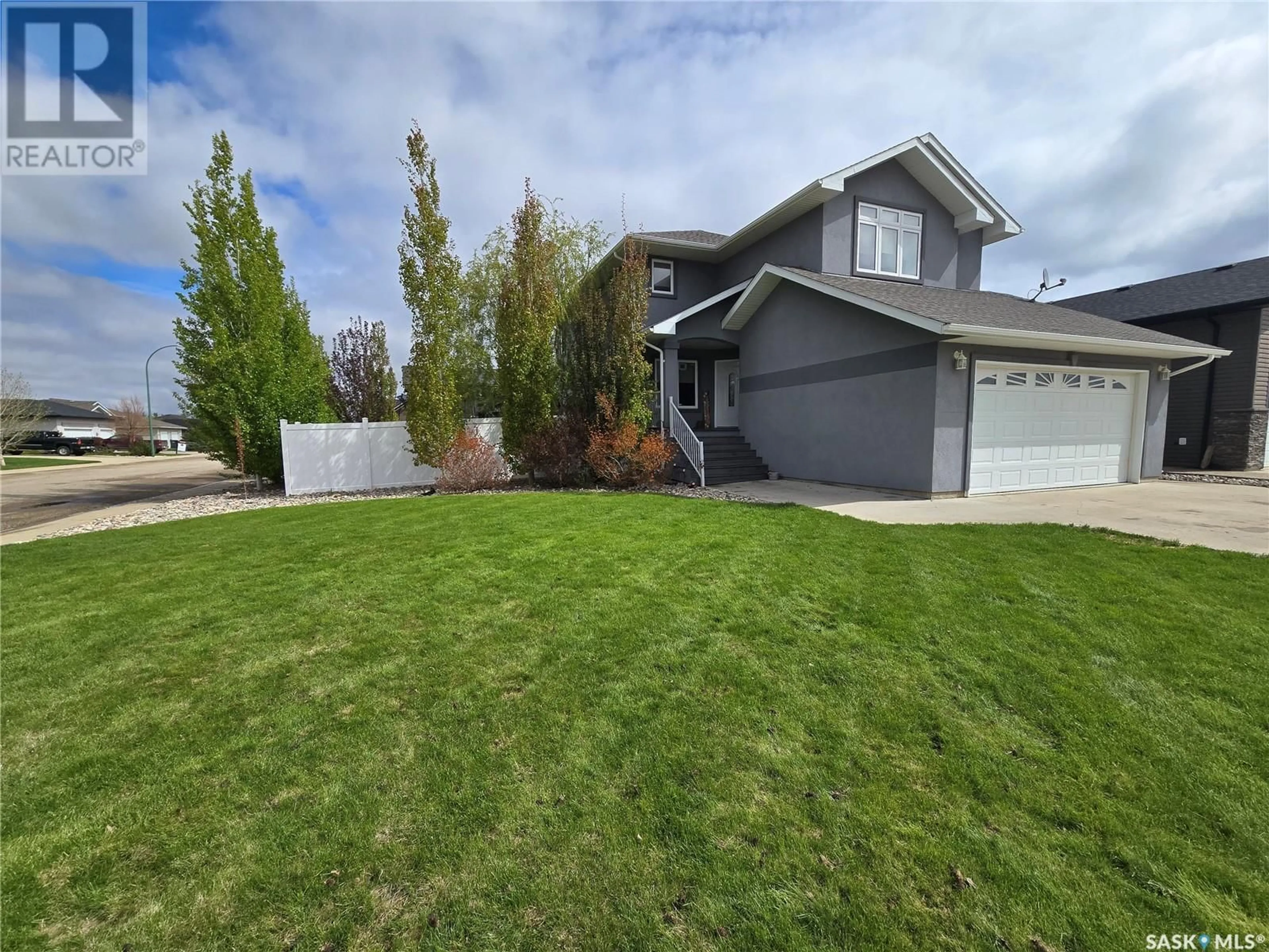 Home with vinyl exterior material, street for 721 BARBER CRESCENT, Weyburn Saskatchewan S4H0B9