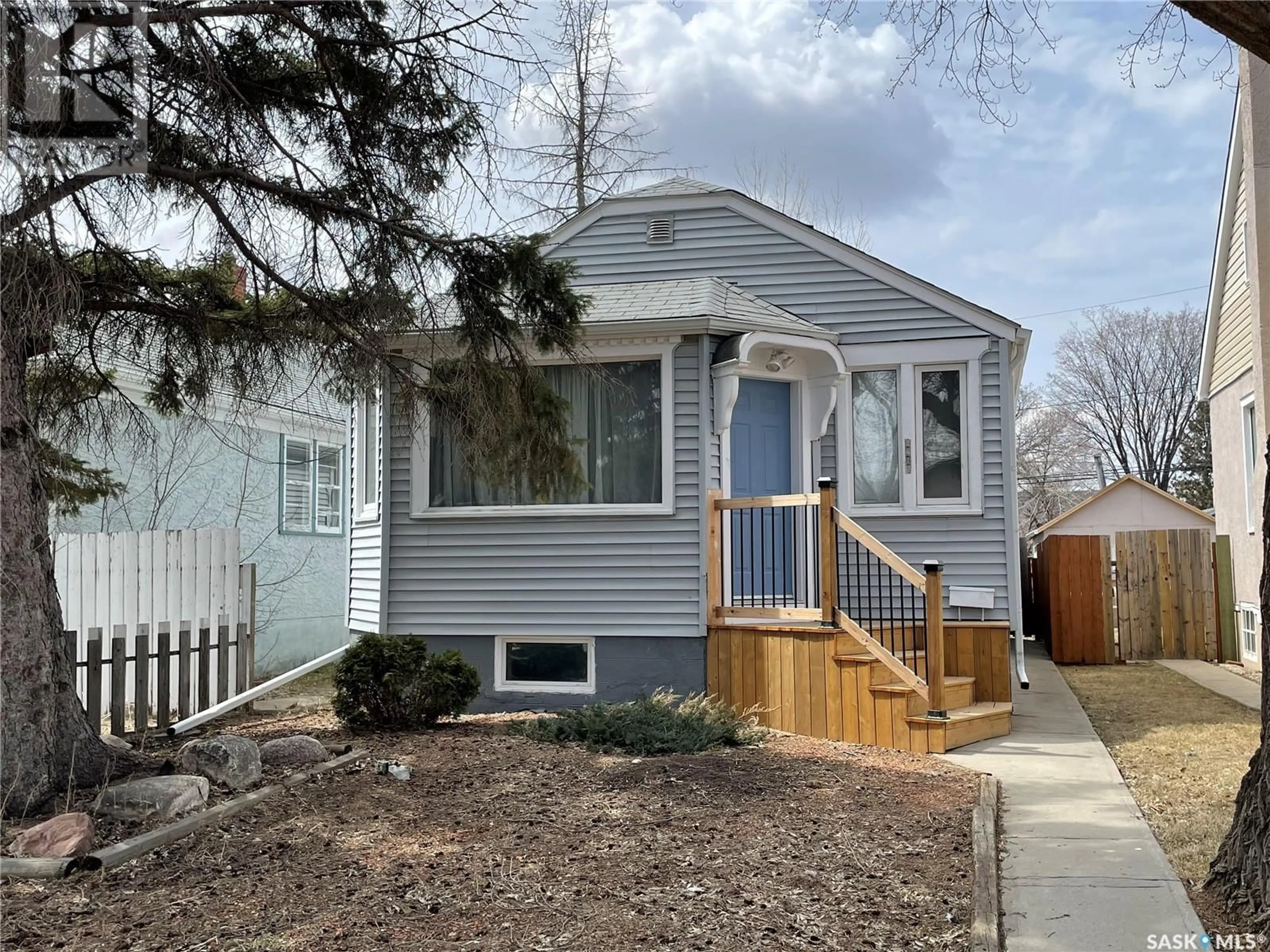 Home with vinyl exterior material, street for 1412 KING STREET, Regina Saskatchewan S4T4G4