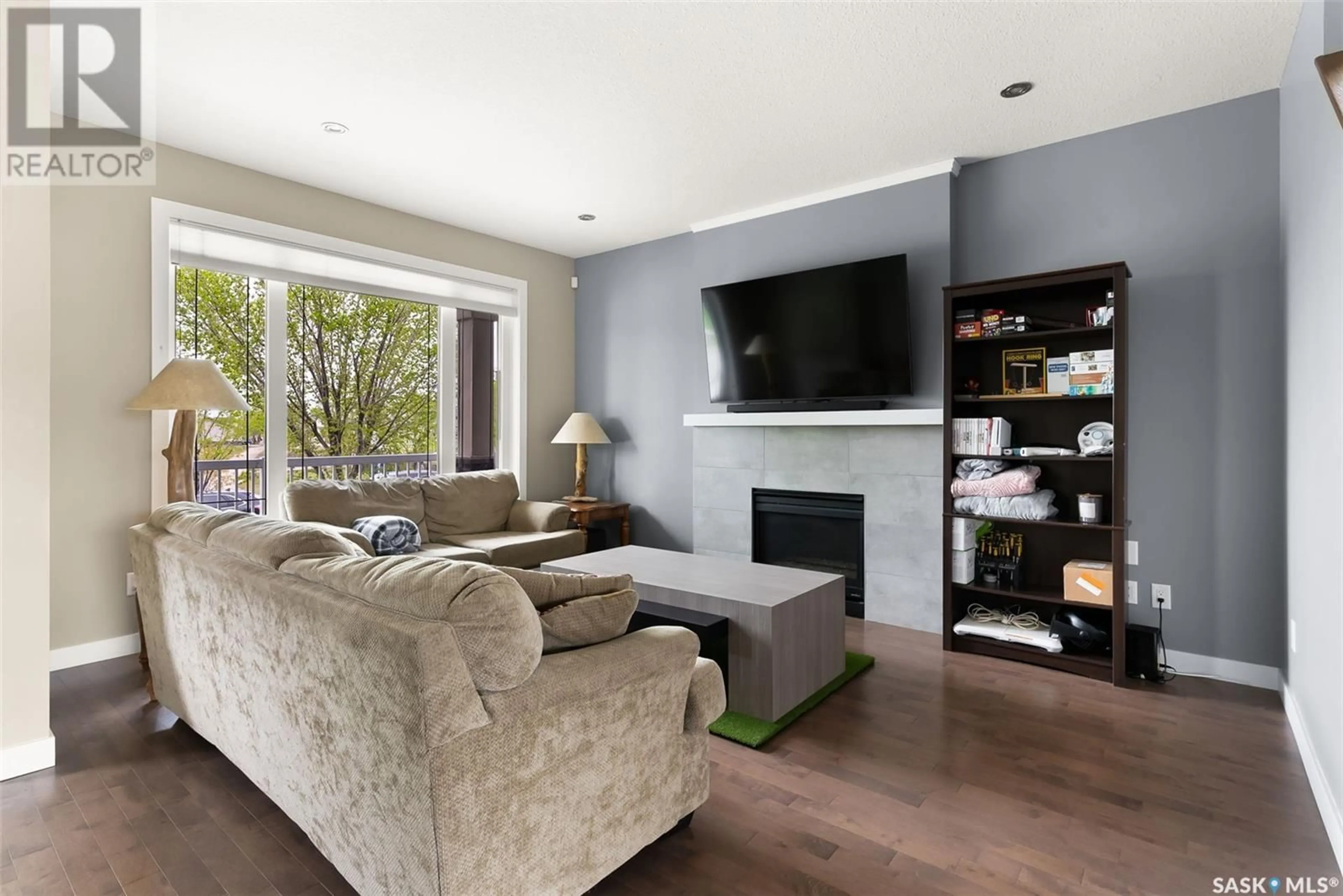 Living room with furniture, wood/laminate floor for 4450 ALBULET DRIVE, Regina Saskatchewan S4W0L6