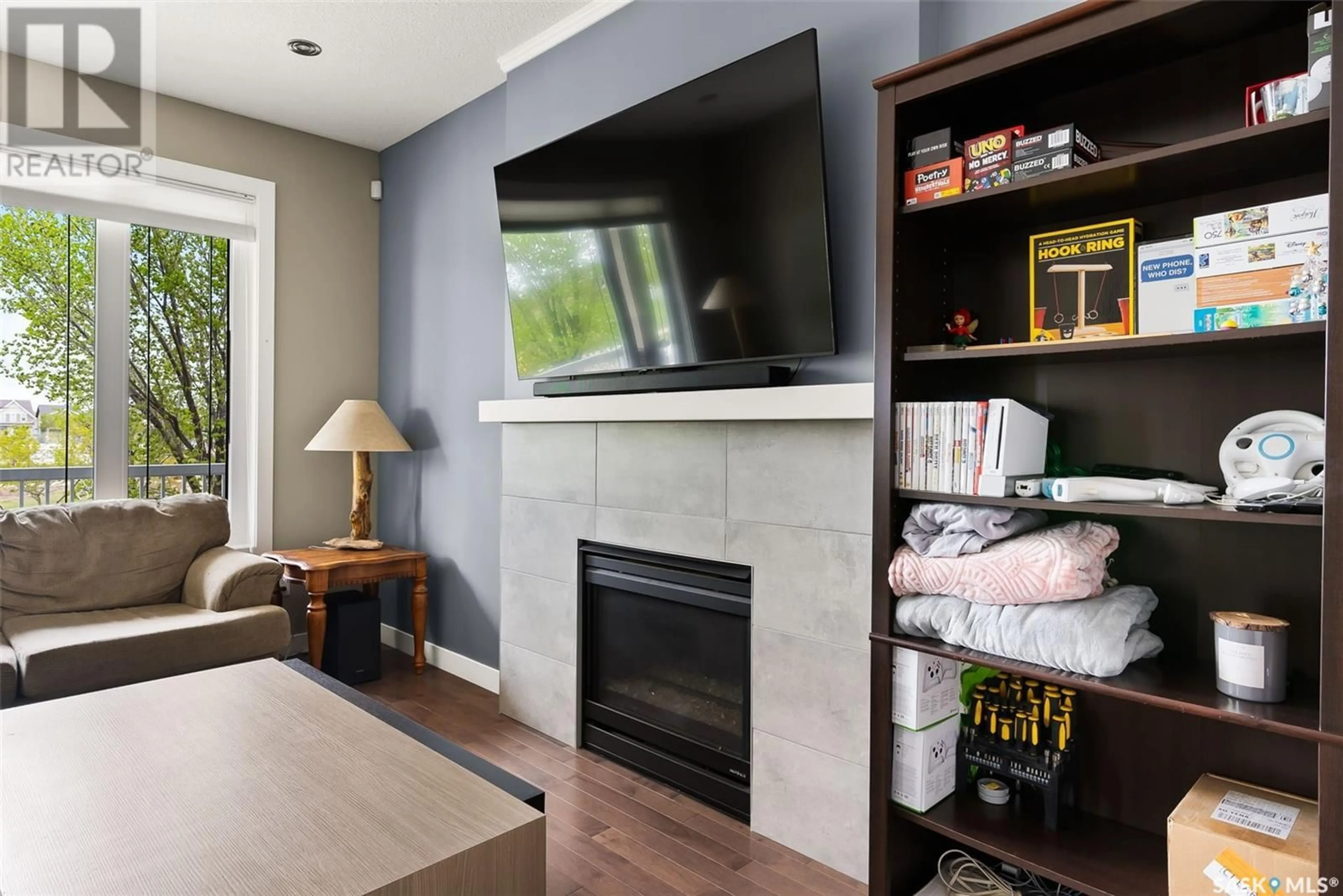 Living room with furniture, wood/laminate floor for 4450 ALBULET DRIVE, Regina Saskatchewan S4W0L6