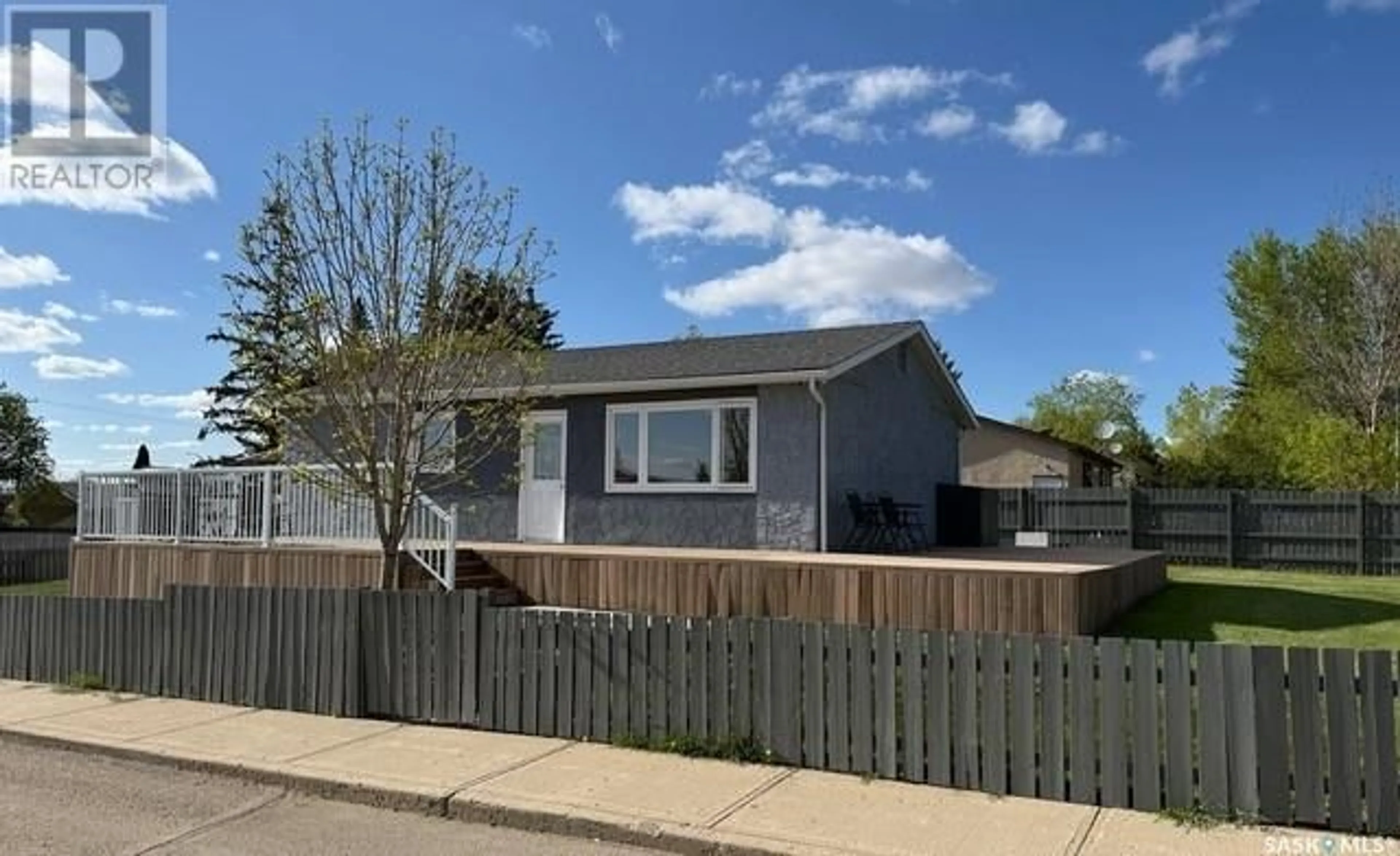 Home with vinyl exterior material, street for 1701 TRUDEAU STREET, North Battleford Saskatchewan S9A3B7