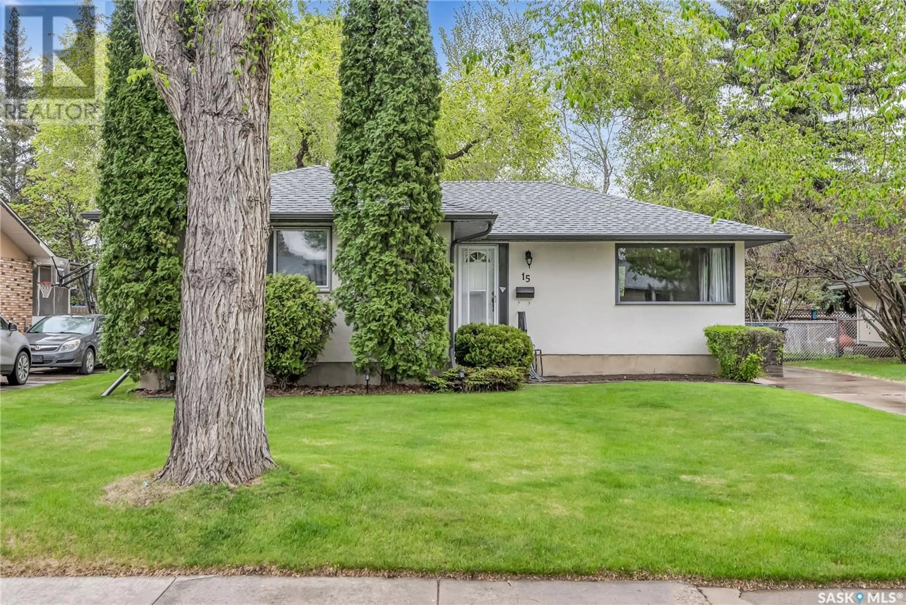 Home with vinyl exterior material, street for 15 MCASKILL CRESCENT, Saskatoon Saskatchewan S7J2P4