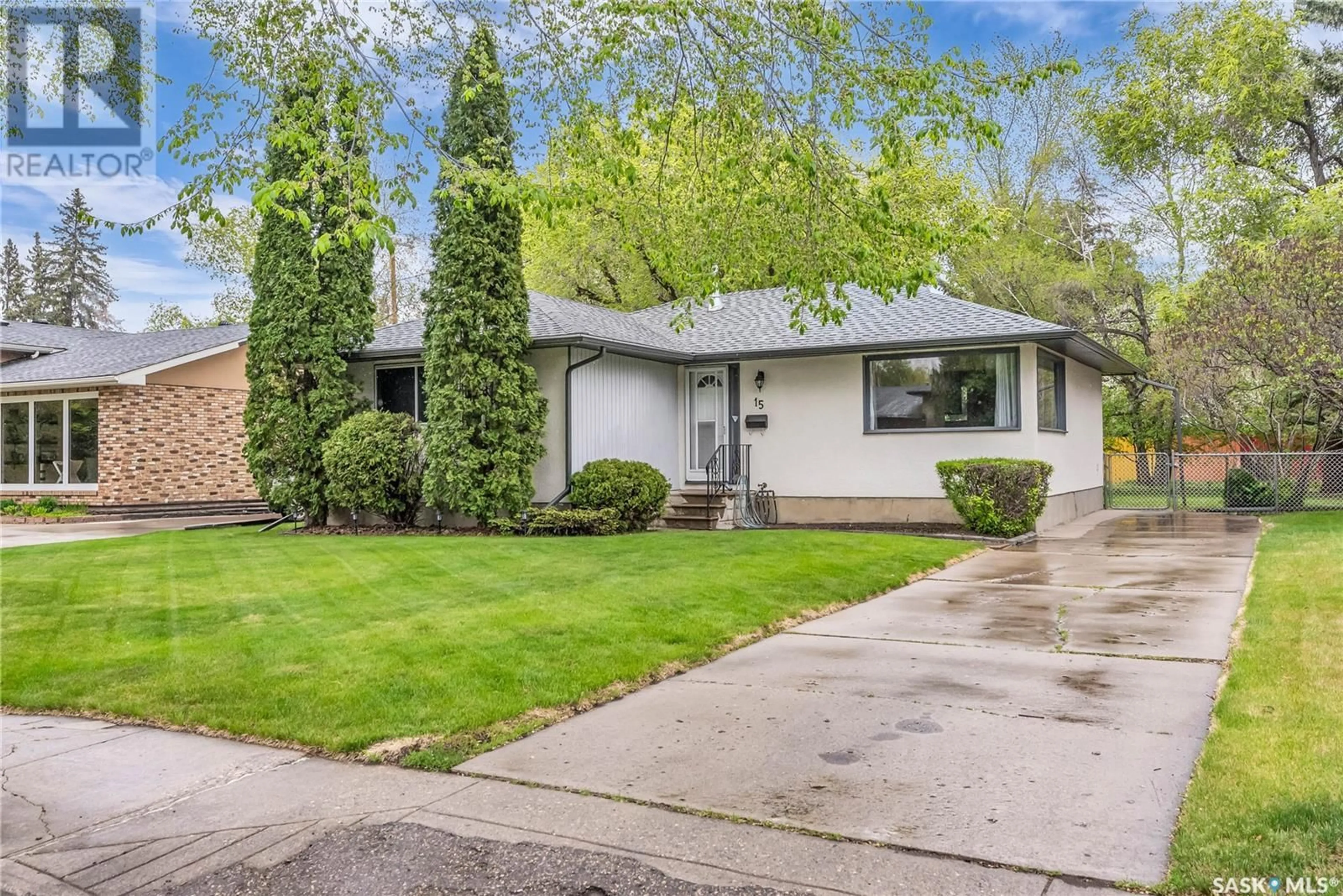 Home with vinyl exterior material, street for 15 MCASKILL CRESCENT, Saskatoon Saskatchewan S7J2P4