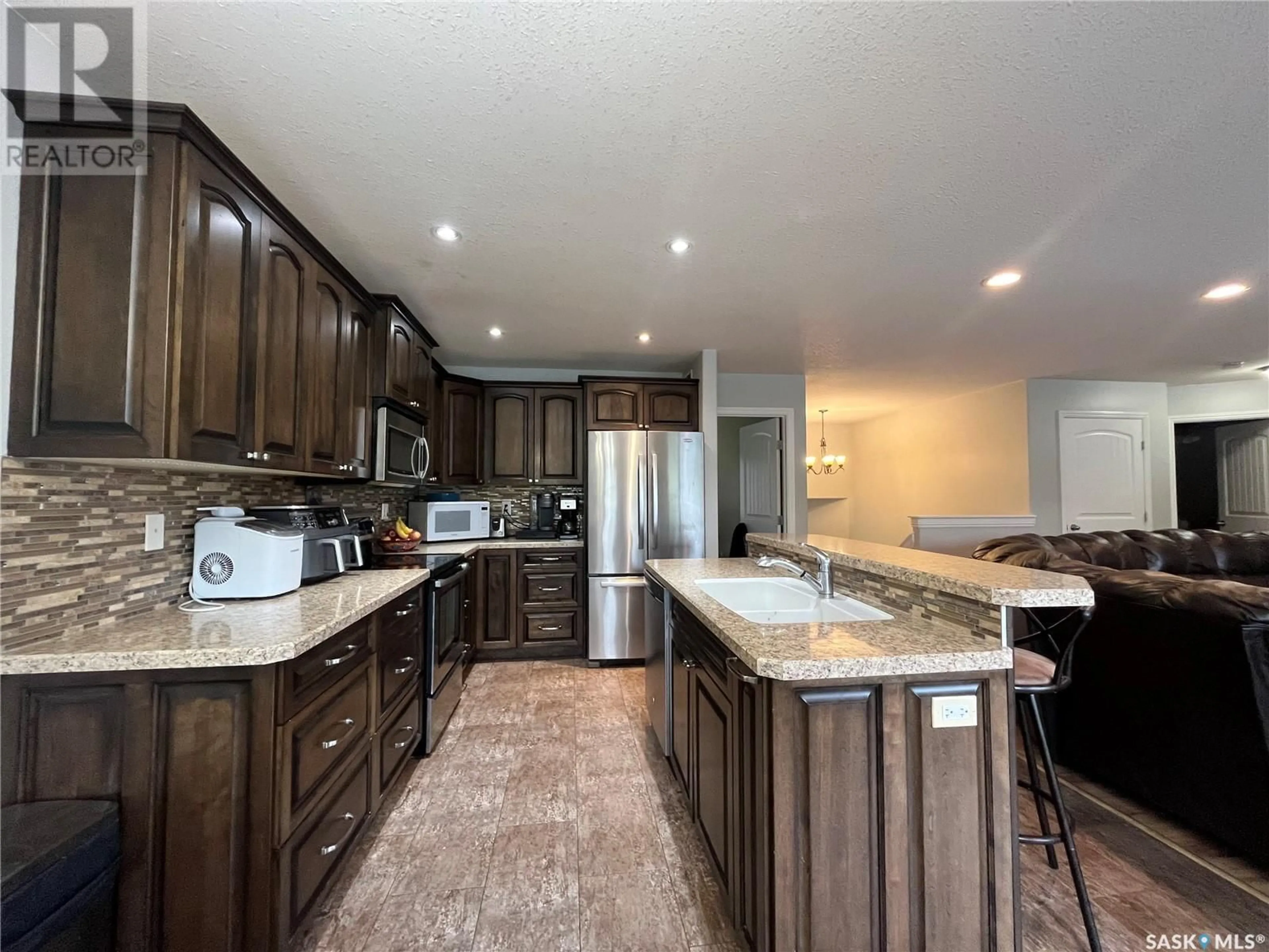 Open concept kitchen, ceramic/tile floor for 705 ST MARY STREET, Esterhazy Saskatchewan S0A0X0