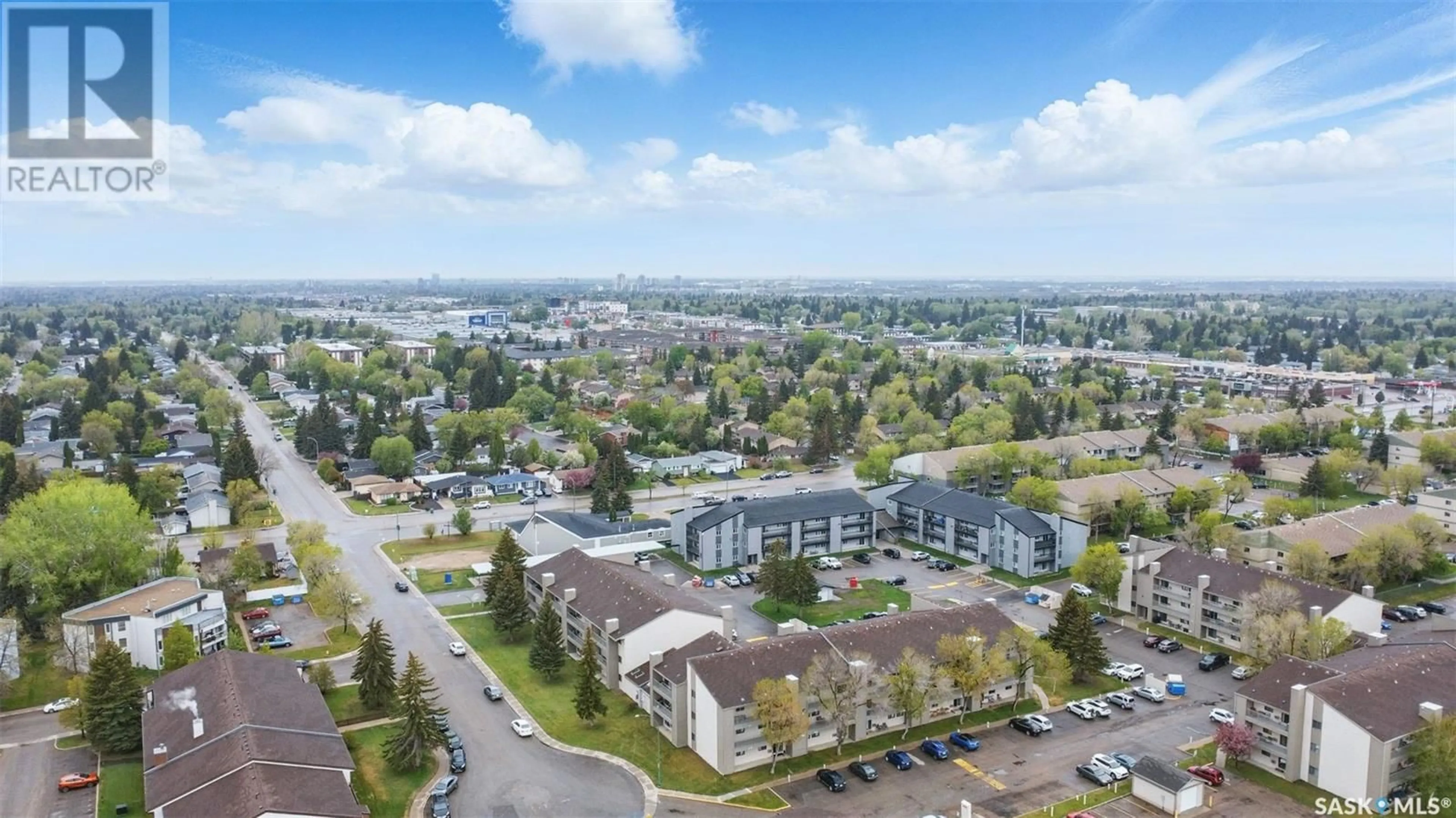 A pic from outside/outdoor area/front of a property/back of a property/a pic from drone, water/lake/river/ocean view for 102 211 TAIT PLACE, Saskatoon Saskatchewan S7H5L5