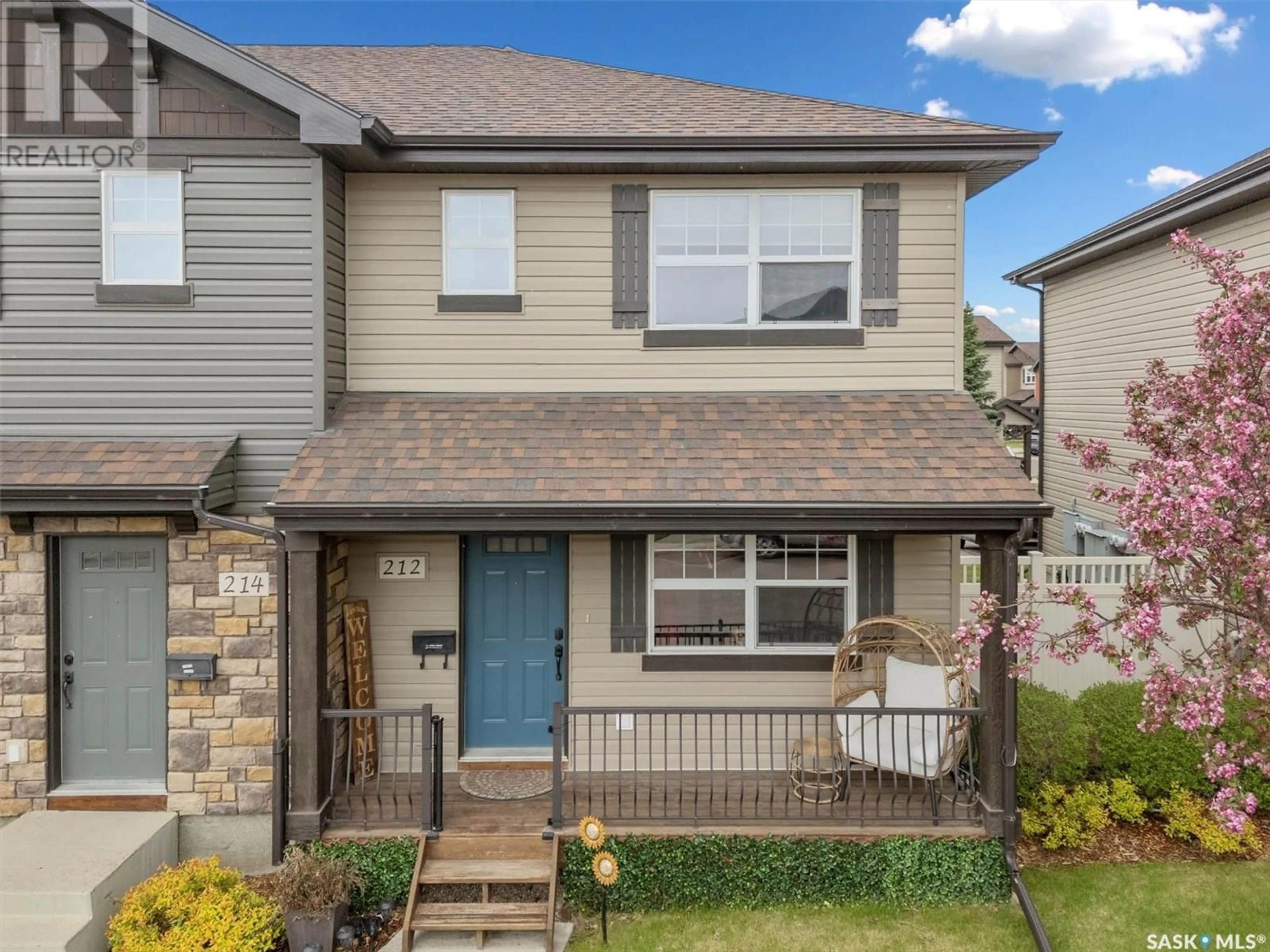 Home with vinyl exterior material, street for 212 LANGLOIS WAY, Saskatoon Saskatchewan S7T0L2