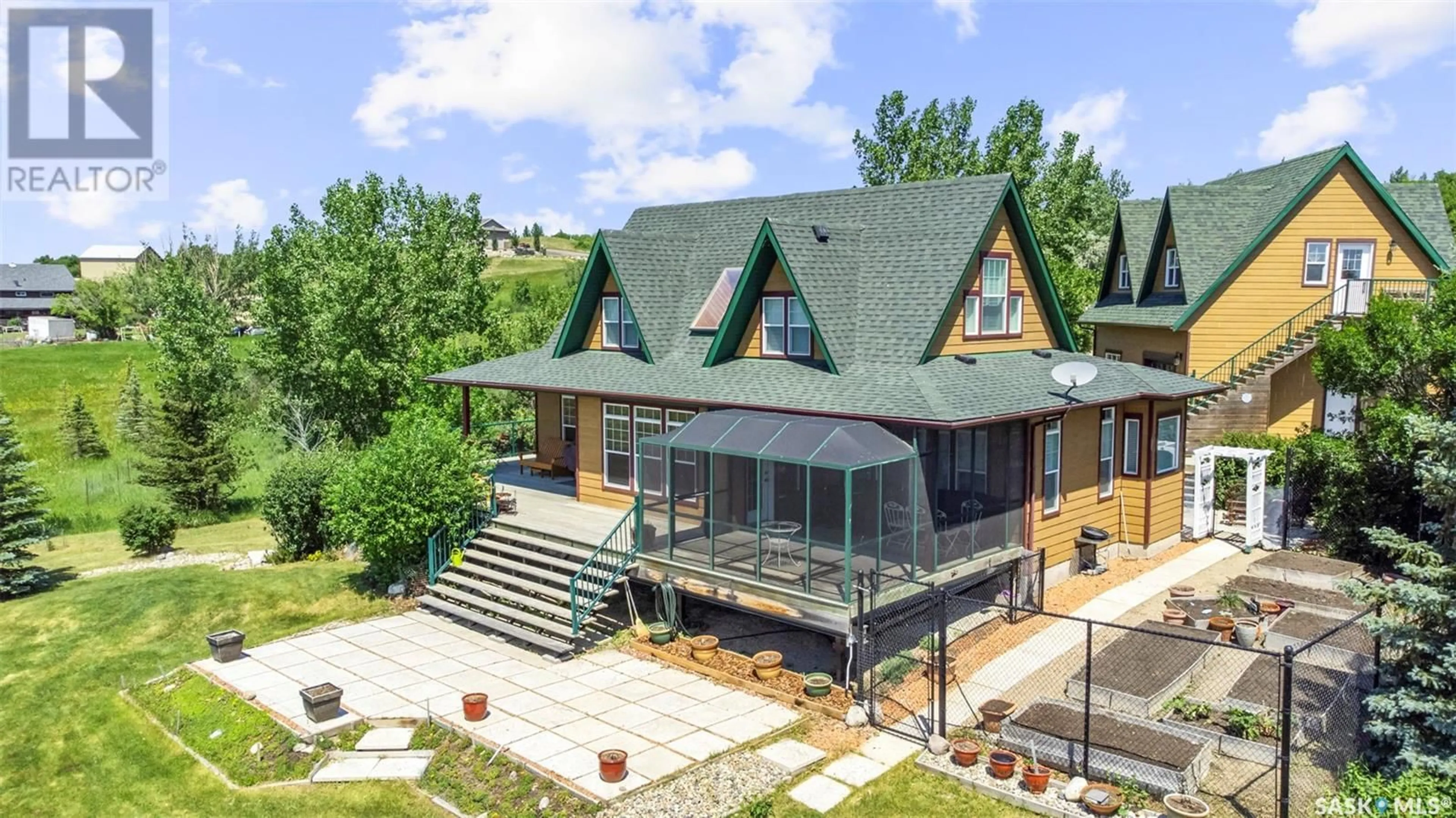 A pic from outside/outdoor area/front of a property/back of a property/a pic from drone, mountain view for 12 WATSON BAY, Mckillop Rm No. 220 Saskatchewan S0G0L0