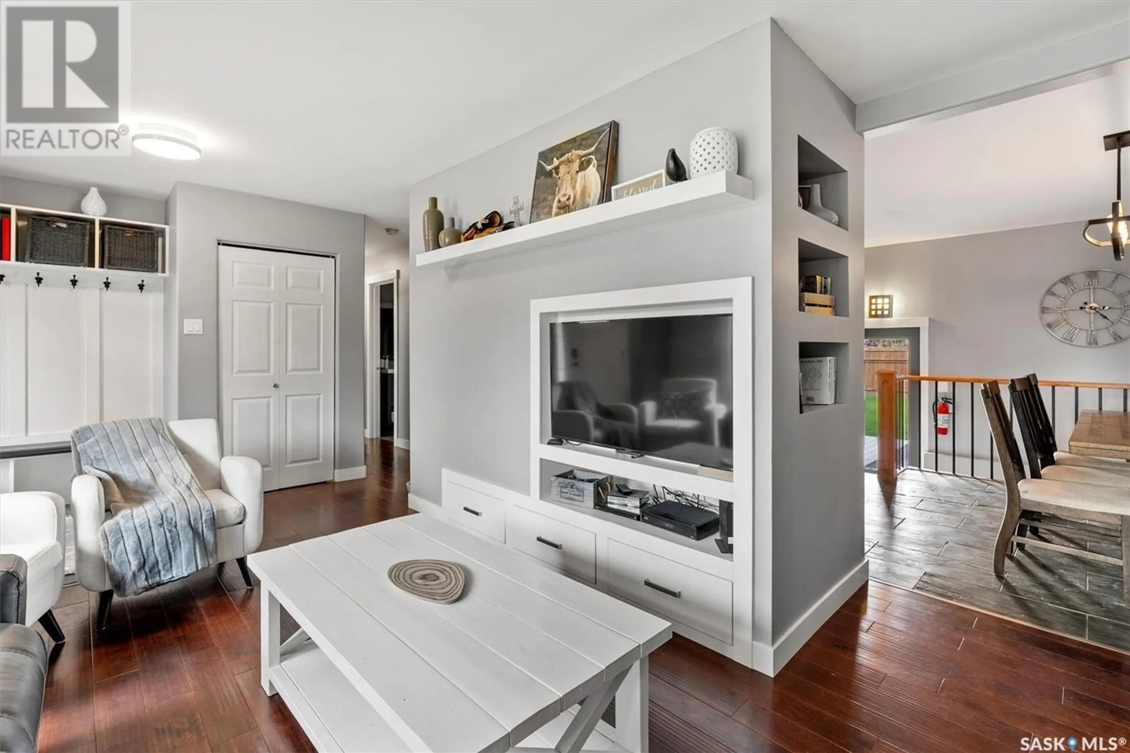 Living room with furniture, wood/laminate floor for 203 EGBERT AVENUE, Saskatoon Saskatchewan S7N1X2