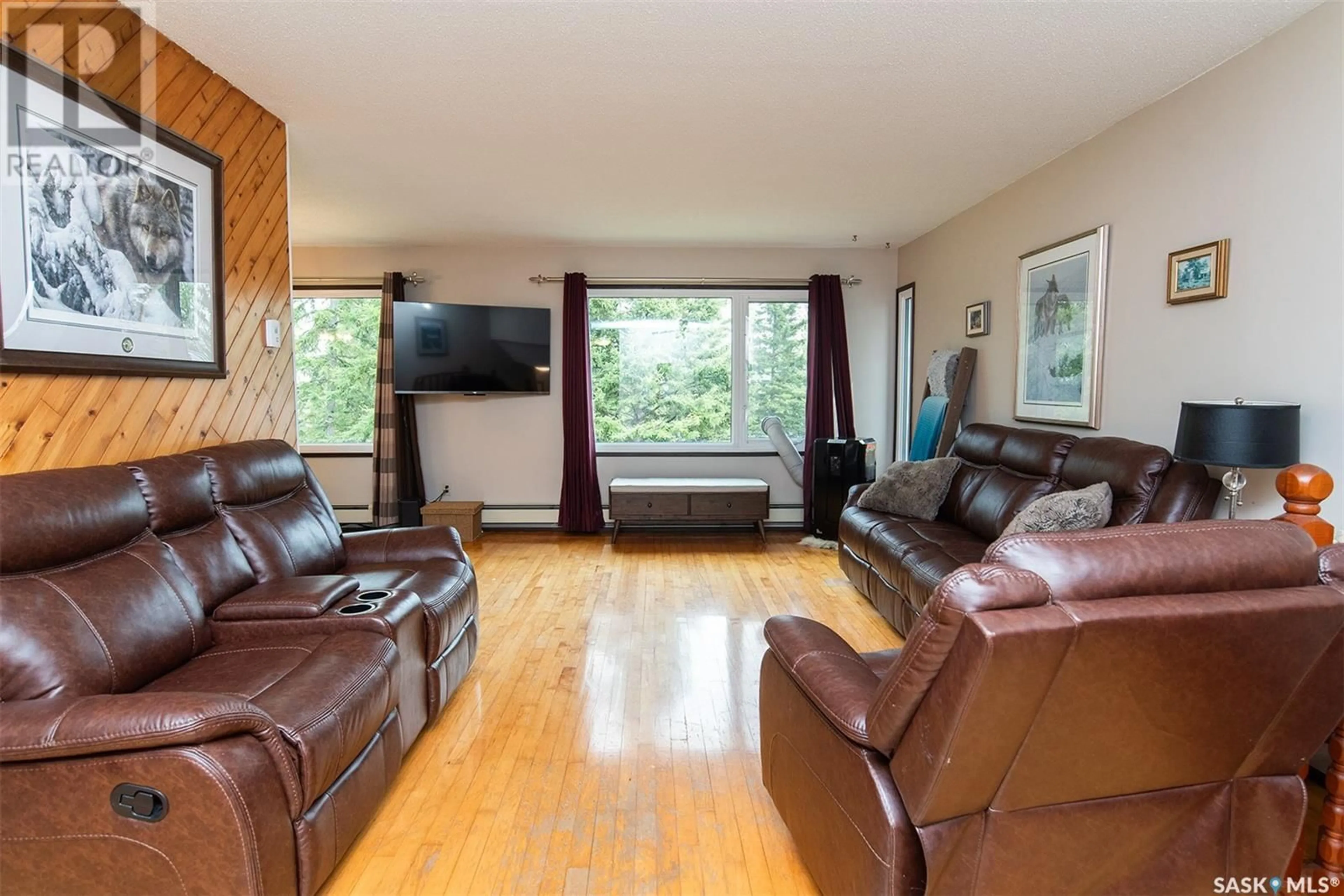 Living room with furniture, wood/laminate floor for FORBES ACREAGE, Wynyard Saskatchewan S0A4T0