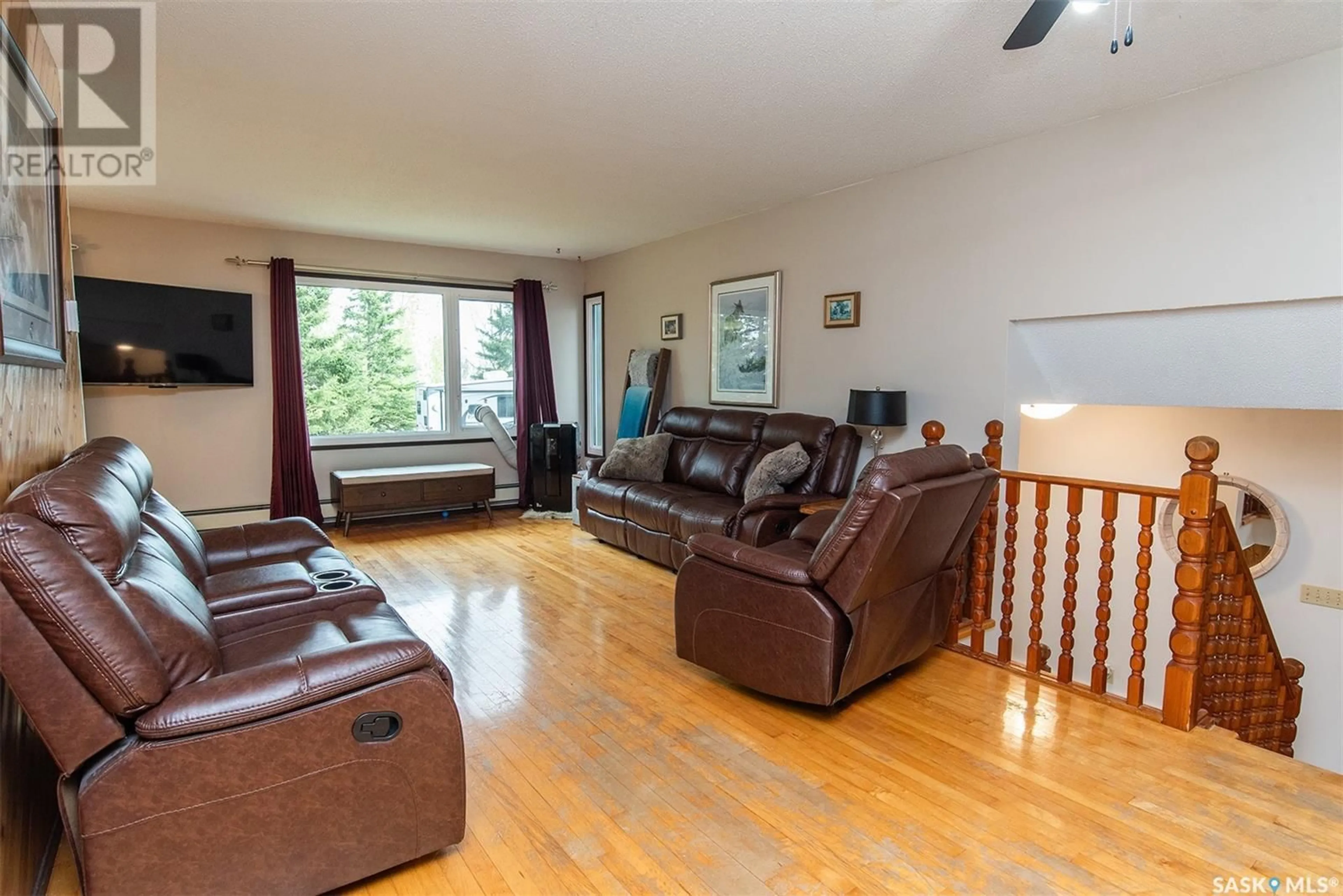 Living room with furniture, wood/laminate floor for FORBES ACREAGE, Wynyard Saskatchewan S0A4T0