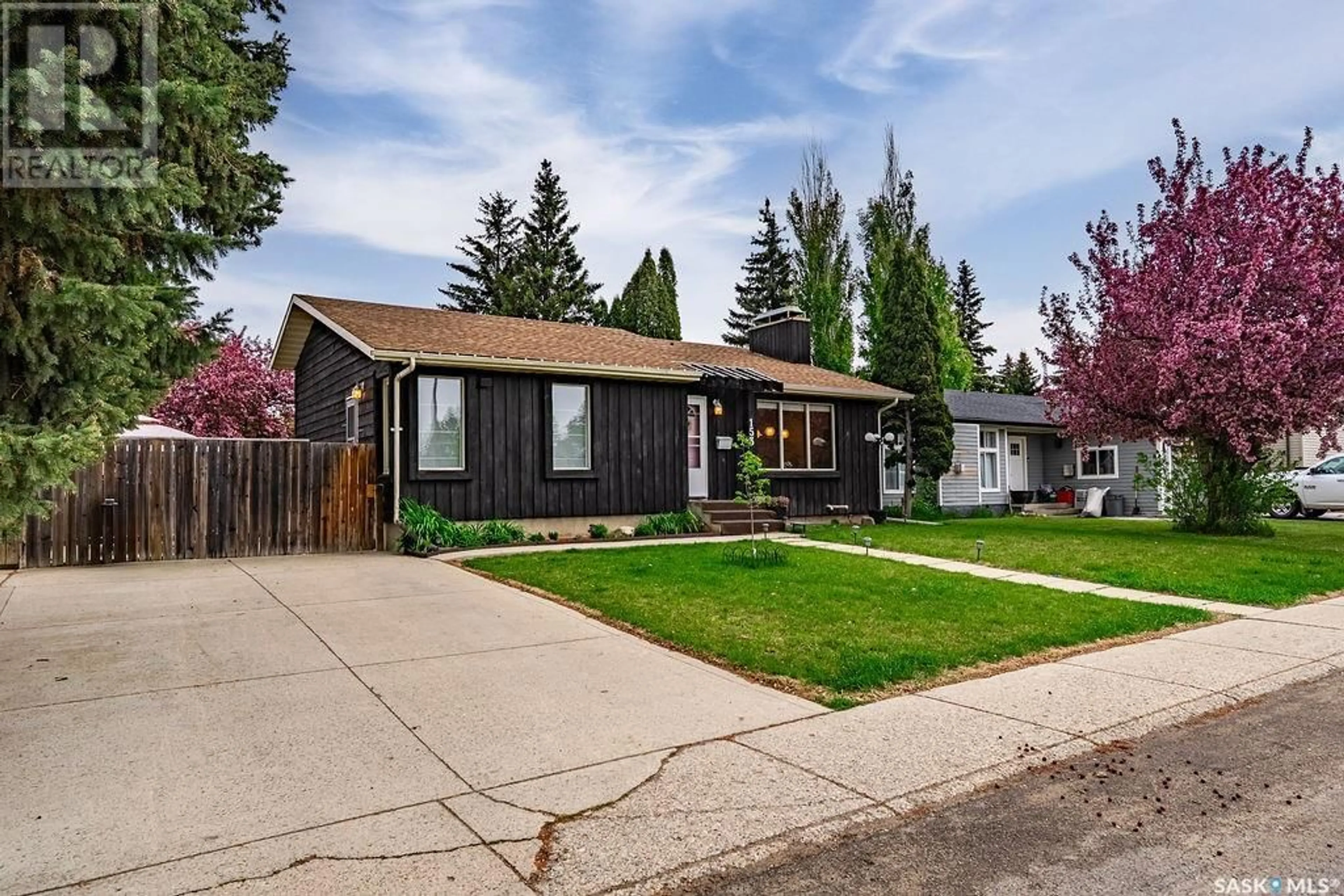 Home with vinyl exterior material, street for 153 STILLWATER DRIVE, Saskatoon Saskatchewan S7J3N9
