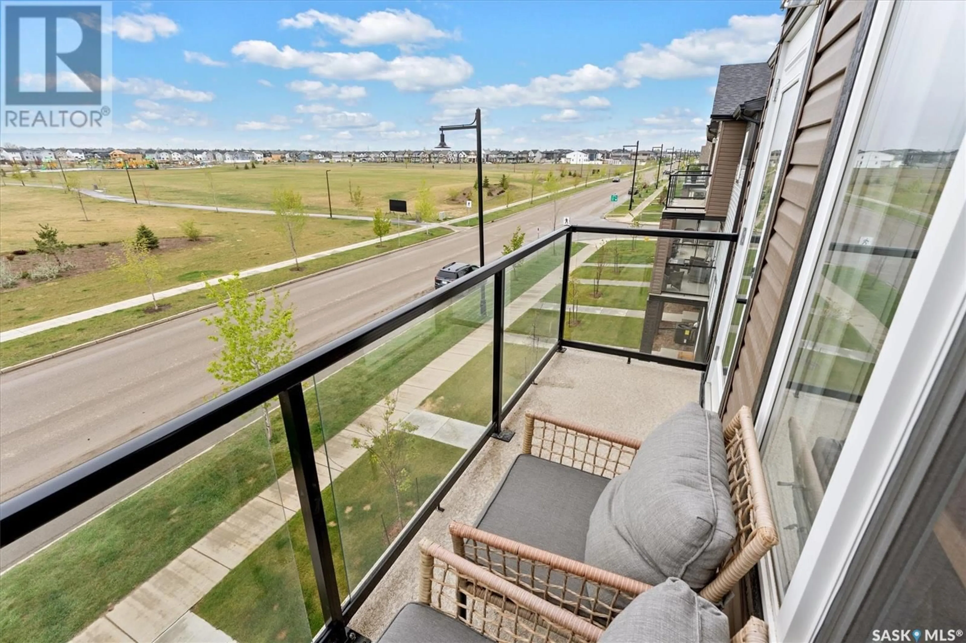 Balcony in the apartment, city buildings view from balcony for 13 651 DUBOIS CRESCENT, Saskatoon Saskatchewan S7V1N3