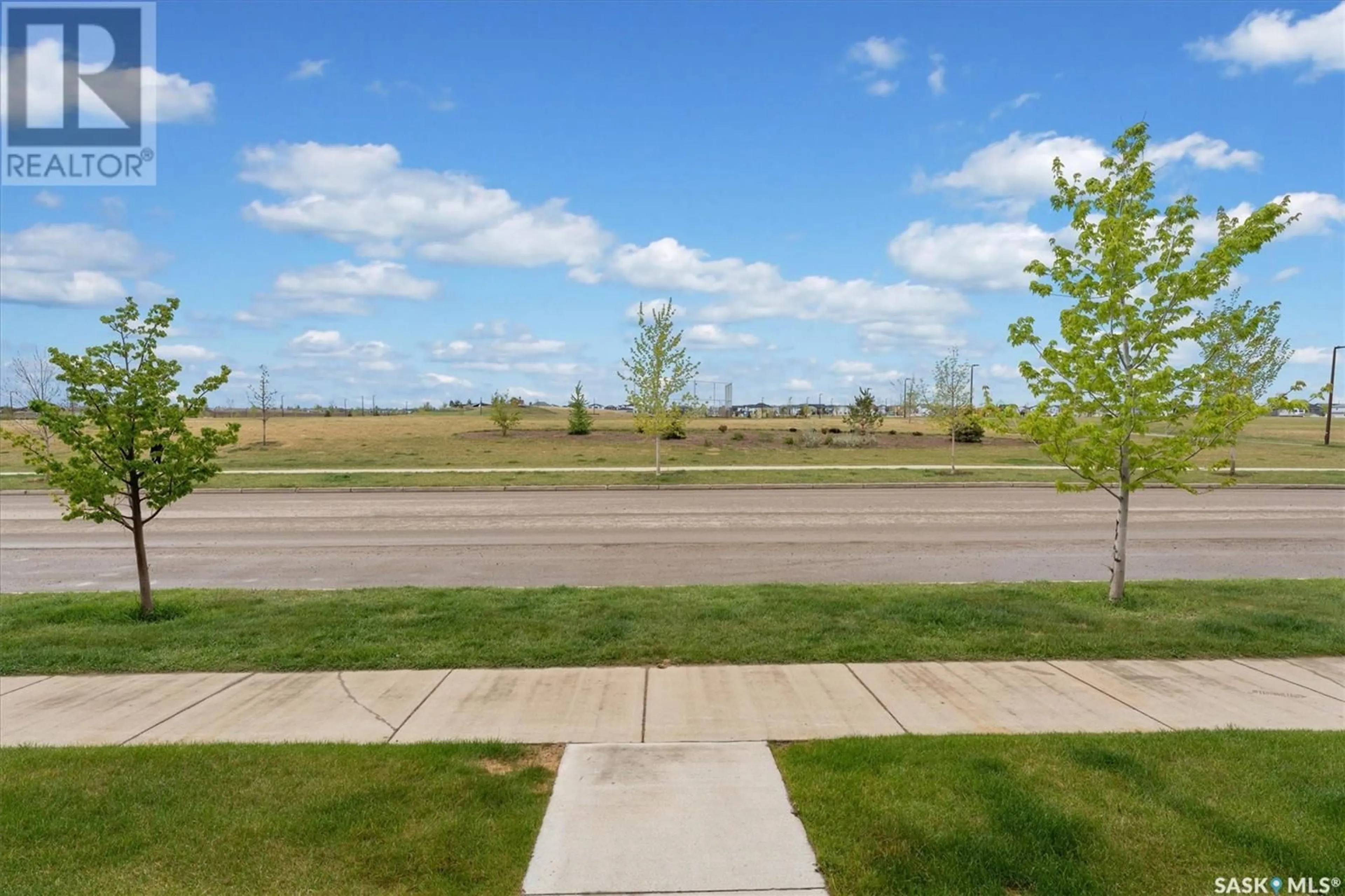 A pic from outside/outdoor area/front of a property/back of a property/a pic from drone, street for 13 651 DUBOIS CRESCENT, Saskatoon Saskatchewan S7V1N3
