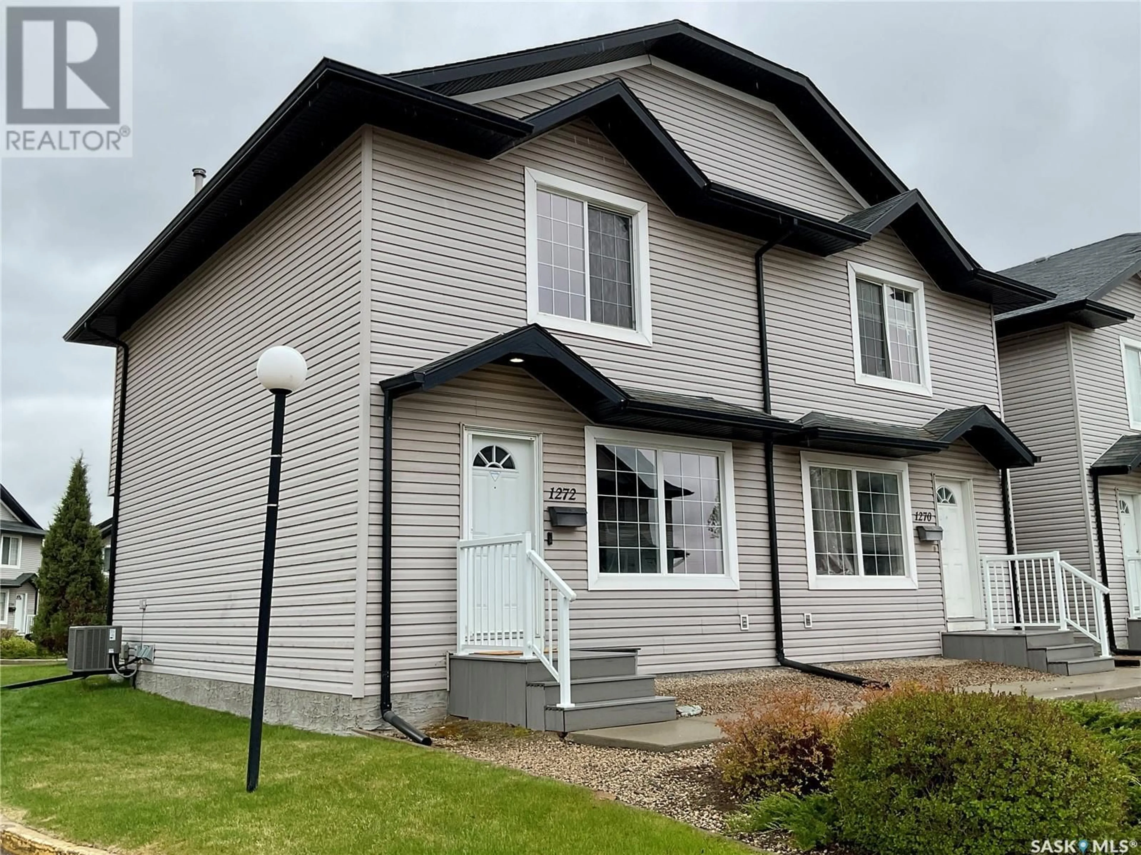 Home with vinyl exterior material, street for 1272 WESSEX PLACE, Regina Saskatchewan S4N7S2