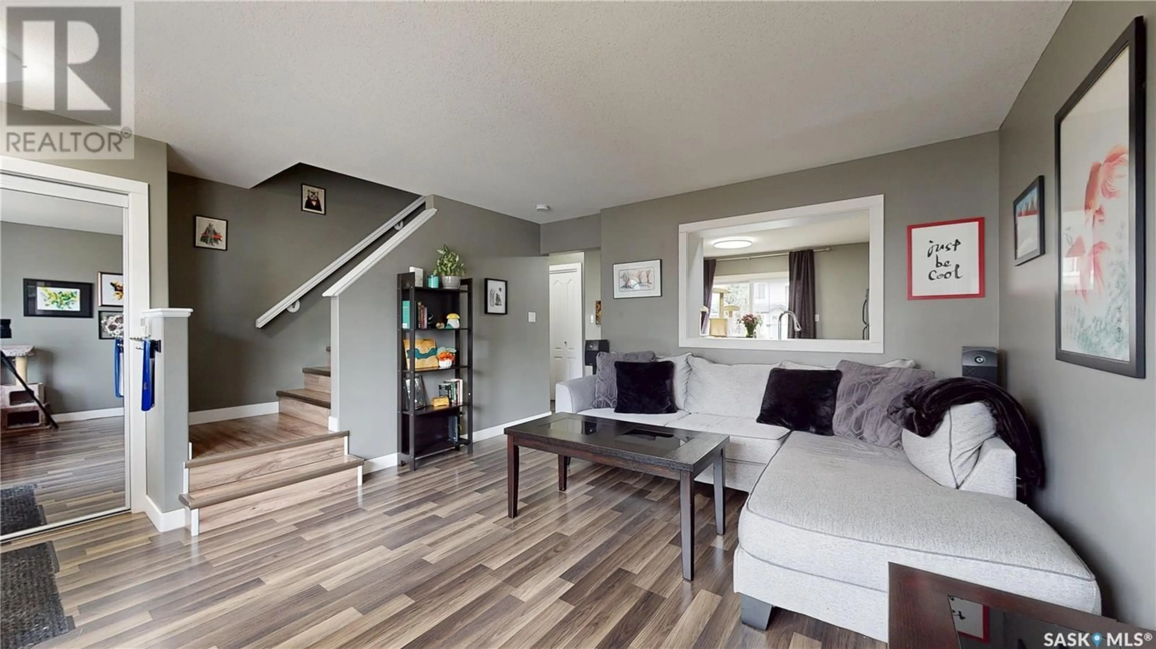 Living room with furniture, wood/laminate floor for 1272 WESSEX PLACE, Regina Saskatchewan S4N7S2