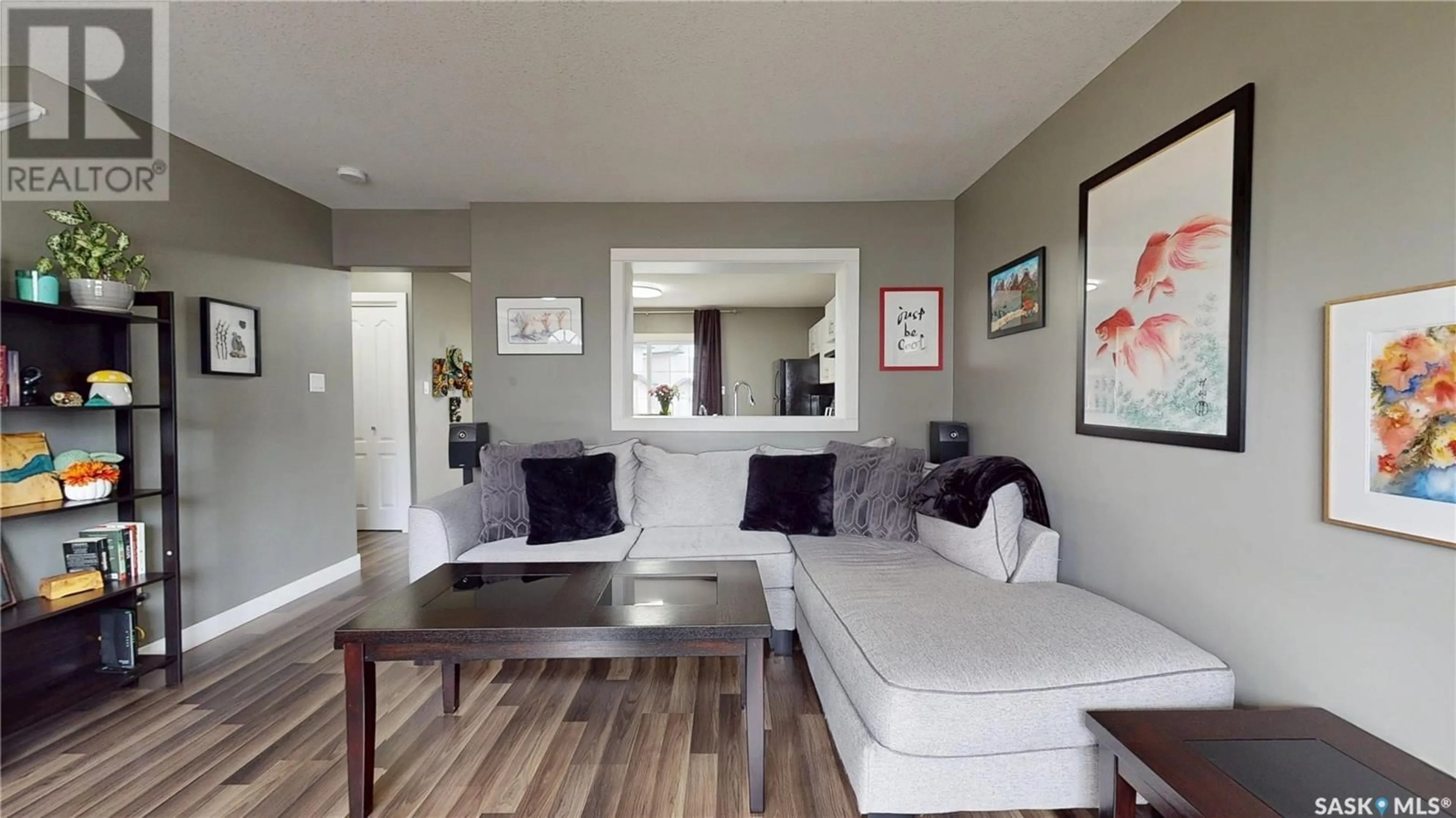 Living room with furniture, wood/laminate floor for 1272 WESSEX PLACE, Regina Saskatchewan S4N7S2